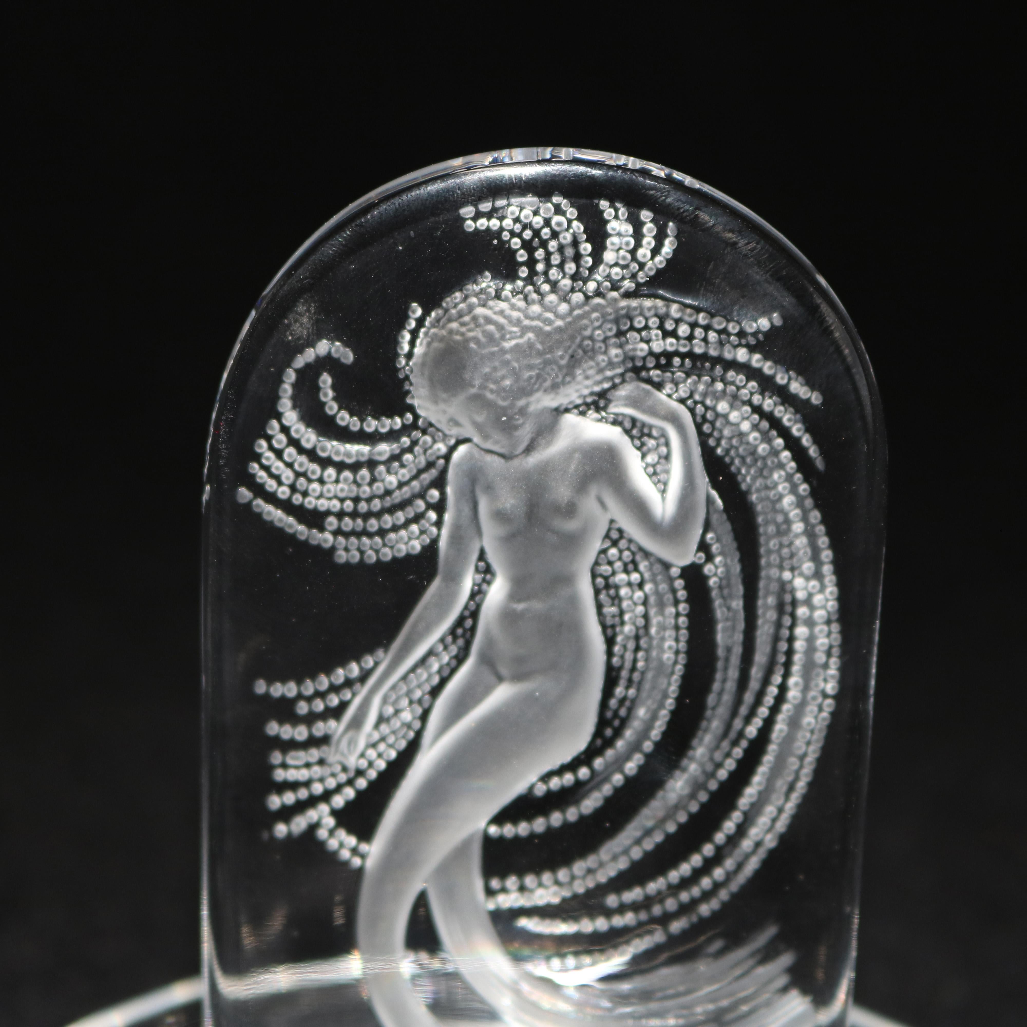 An Art Nouveau French art glass dresser pin tray by Lalique offers upper plaque depicting woman surmounting lower pin or jewelry tray, signed Lalique, France, 20th century

Measures: 4.13