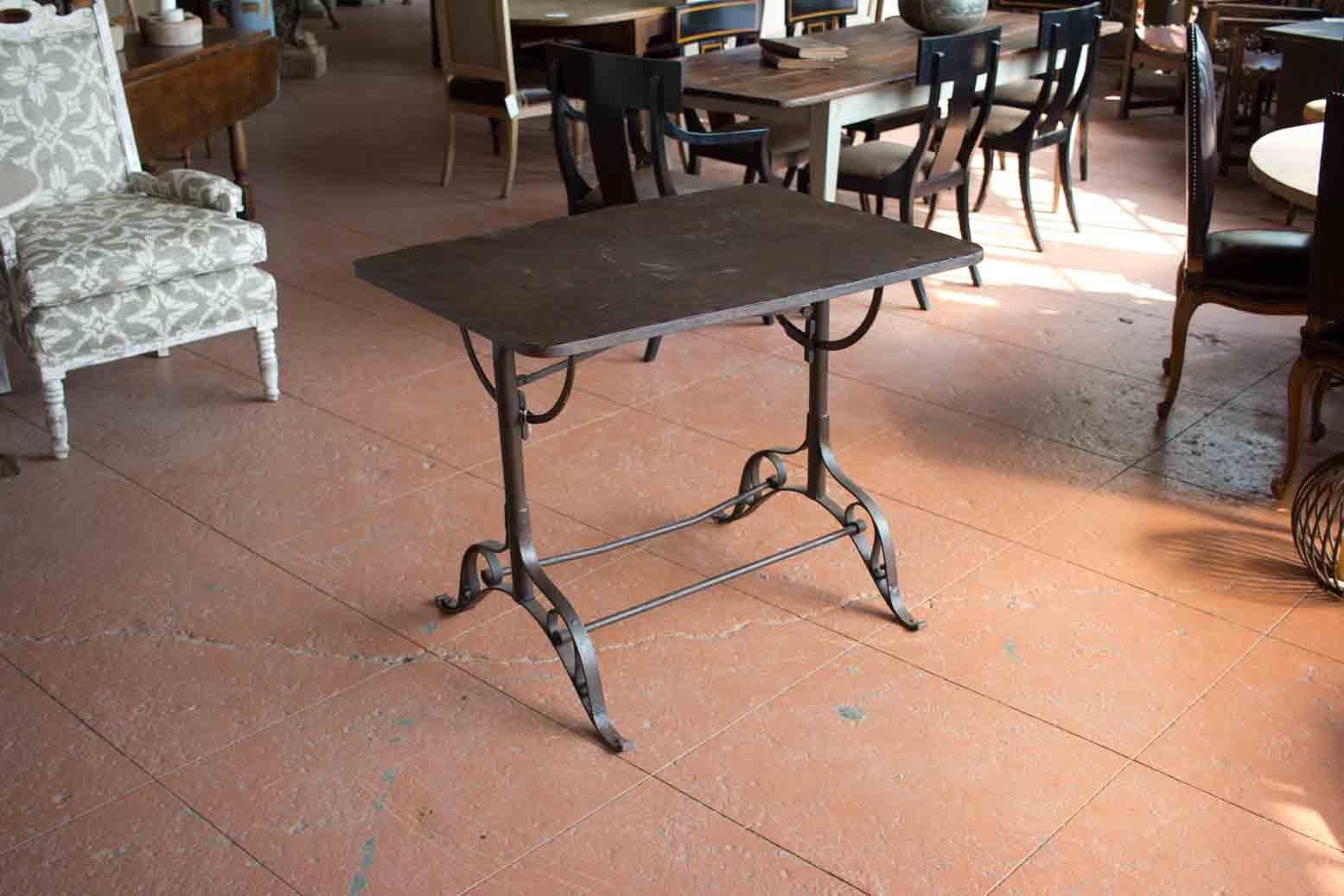 Unusual Art Nouveau metal drop sided table on lovely scrolled legs. The table flips down for easy storage. Great breakfast or garden table. It has an overall beautiful sealed patina.
