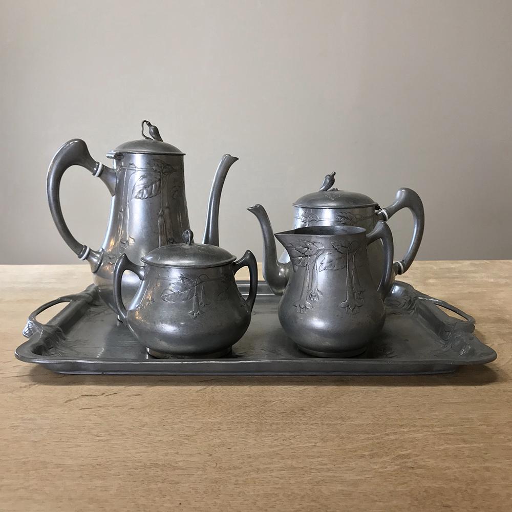 Art Nouveau period French Pewter coffee service set. Elegant complete French five-piece pewter tea set. Coffee and tea pots, cream and sugar. Matching Art Nouveau style tray is included in the set.
Measures overall: 8.5H x 15W x 10.5D
circa 1890.