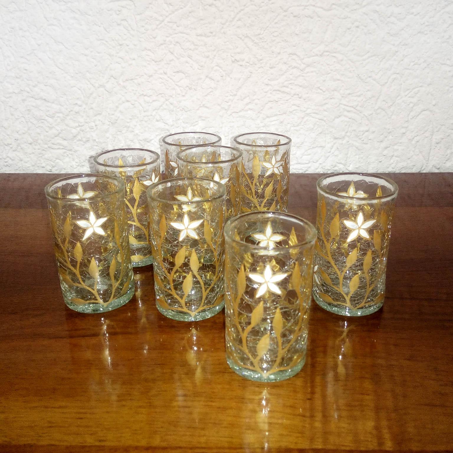 Art Nouveau gold and white enamel Craqueled tea glasses/
Very rare Art Nouveau tea glasses made of crackled glass, painted branches with liquid gold and white enamel star flowers.
Excellent condition.
Size: Height 9 cm.
  