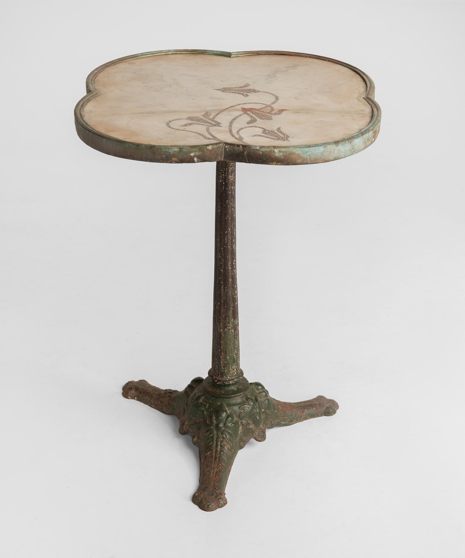 Art Nouveau garden table, circa 1900

Quatrefoil table with inlaid marble-top and brass surround.