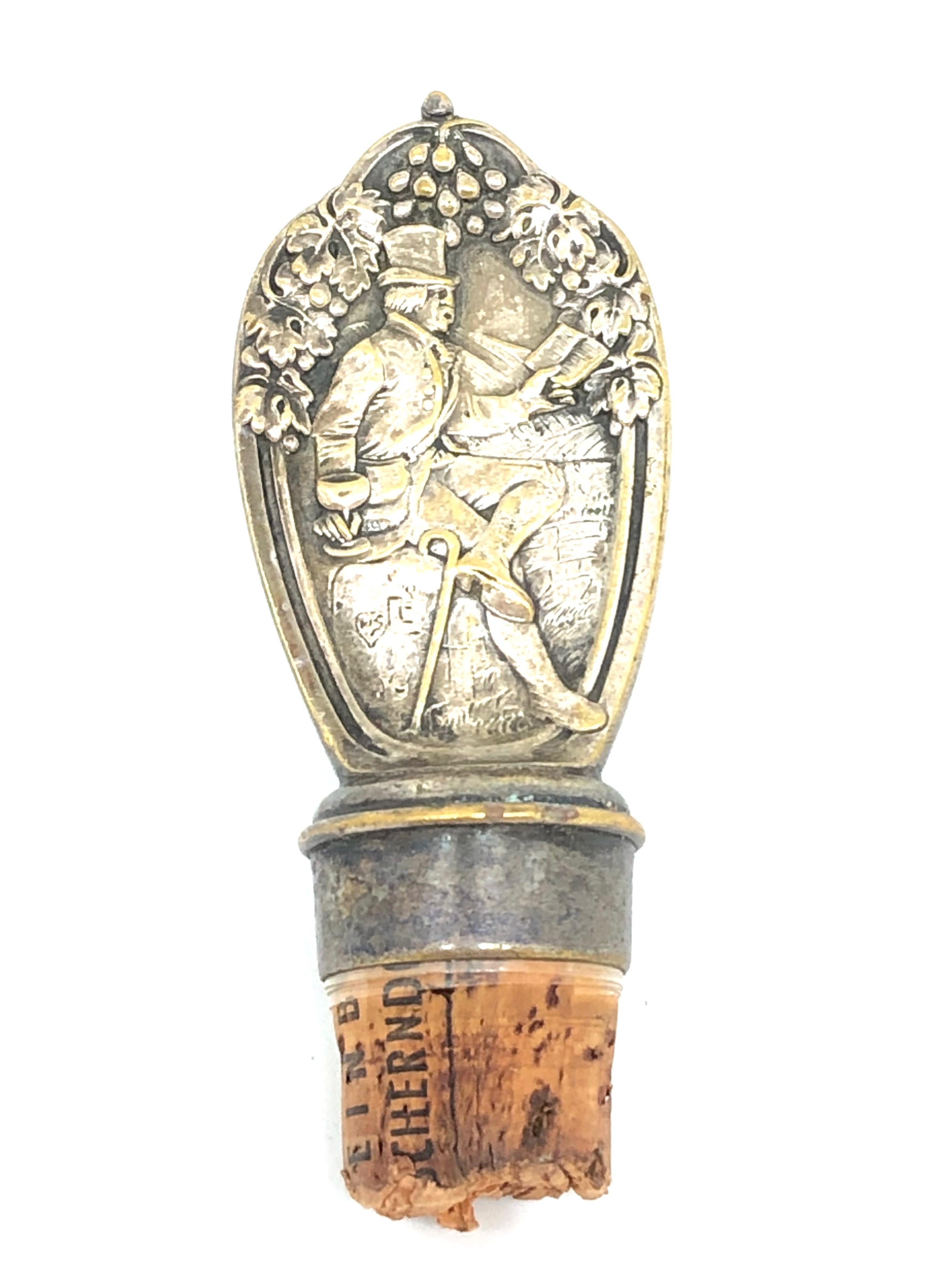 A beautiful metal and cork bottle stopper. Some wear with a nice patina or plating lost, but this is old-age. Made of metal and cork. A beautiful nice Barware item or just a display item in your collections of antique bottle stoppers.

   