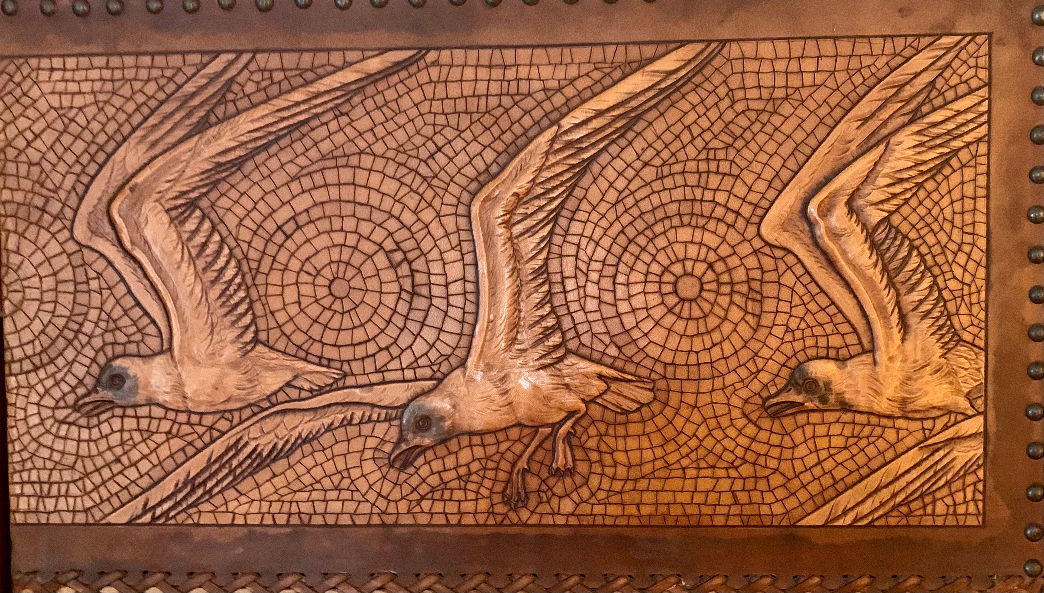 Large Georg Hulbe Art Nouveau tooled leather three panel screen
The central panels featuring a Sailing motif with superbly detailed tooled leather seagulls upper panels and classic Art Nouveau design elements at the base. 
References: an identical