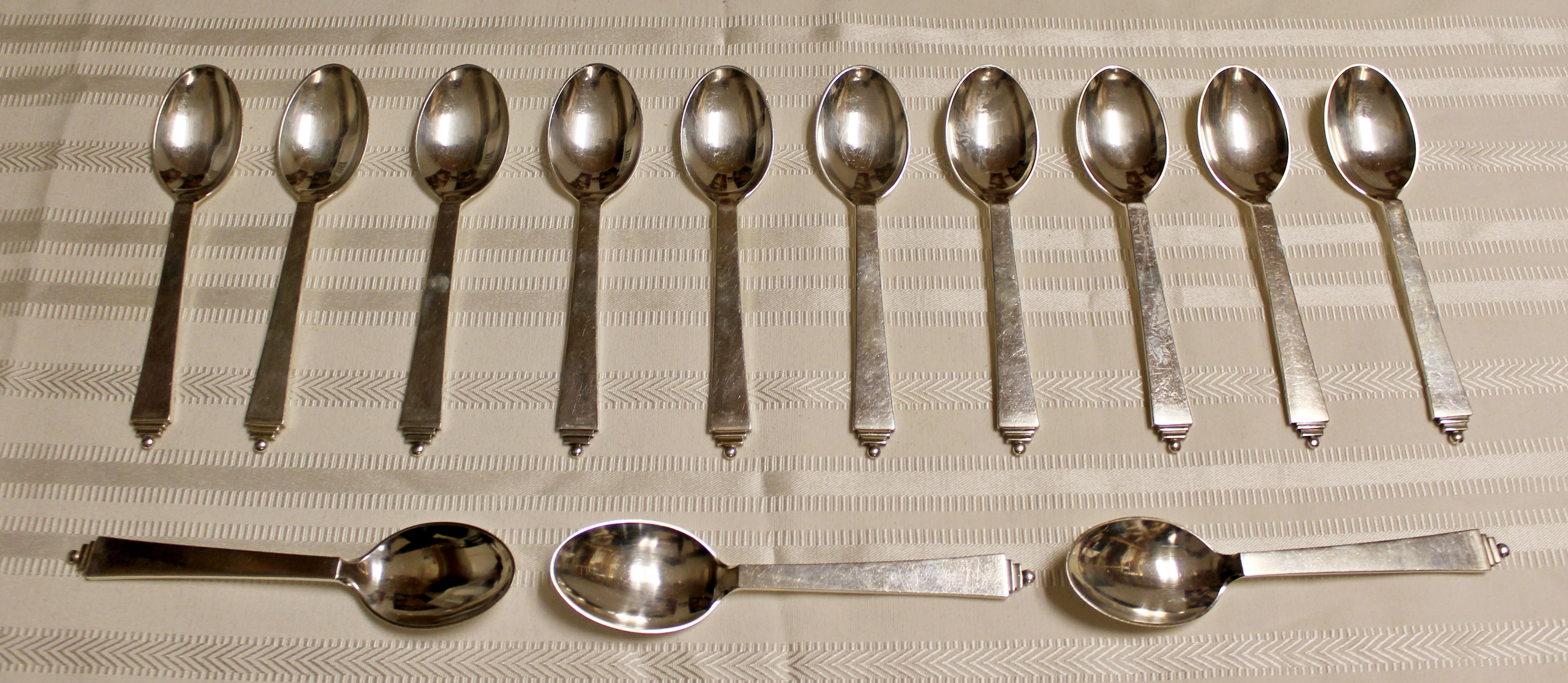 For your consideration is a fantastic set of 13 Georg Jensen, sterling silver pyramid pattern tea spoons, circa 1945. In excellent vintage condition. The dimensions are 5.5