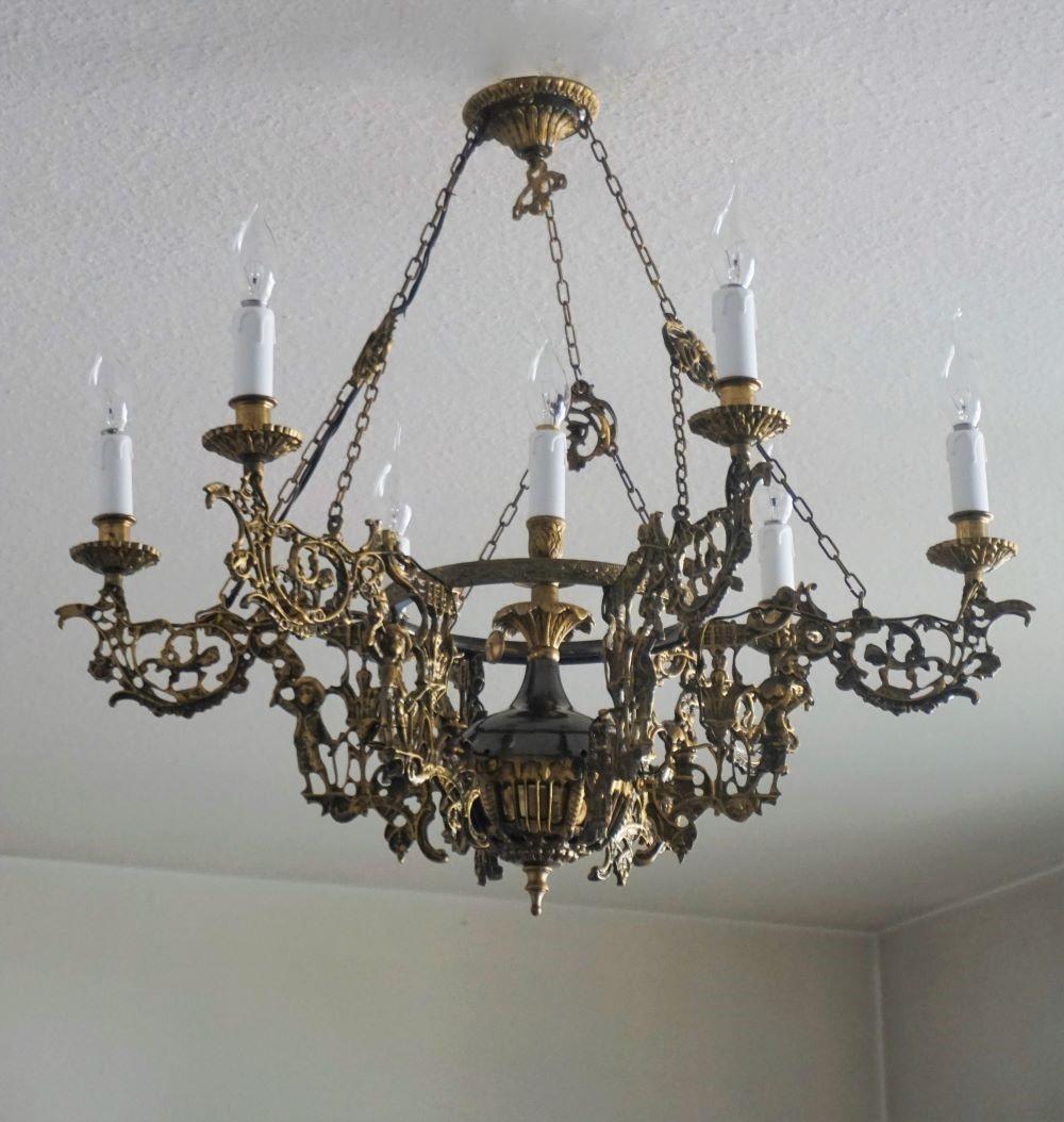 Large Art Nouveau solid gild and patinated bronze parcel brass seven-light chandelier, six light arms richly ornate, France, 1920-1929.
This chandelier has been electrified with seven candelabra E14 light sockets.
Measures:
Height 28 in / 71 cm,