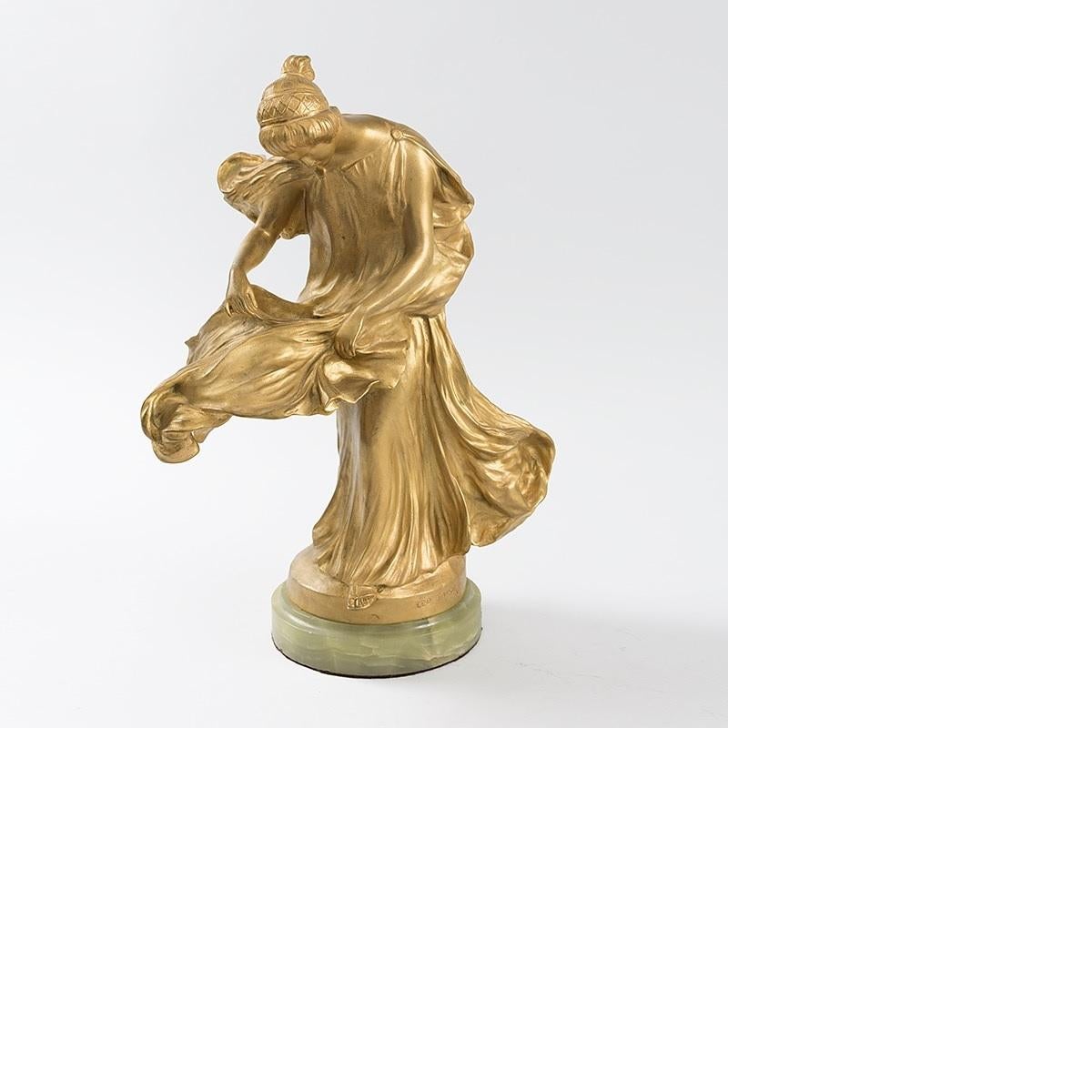 A French Art Nouveau gilt bronze figural lamp by Leo Laporte-Blairsy. The lamp depicts a classically draped female raised on a circular onyx base. Her lifted skirt creating the shade, Circa 1900.

Provenance: Mr. Kenneth W. Davis, Fort Worth,