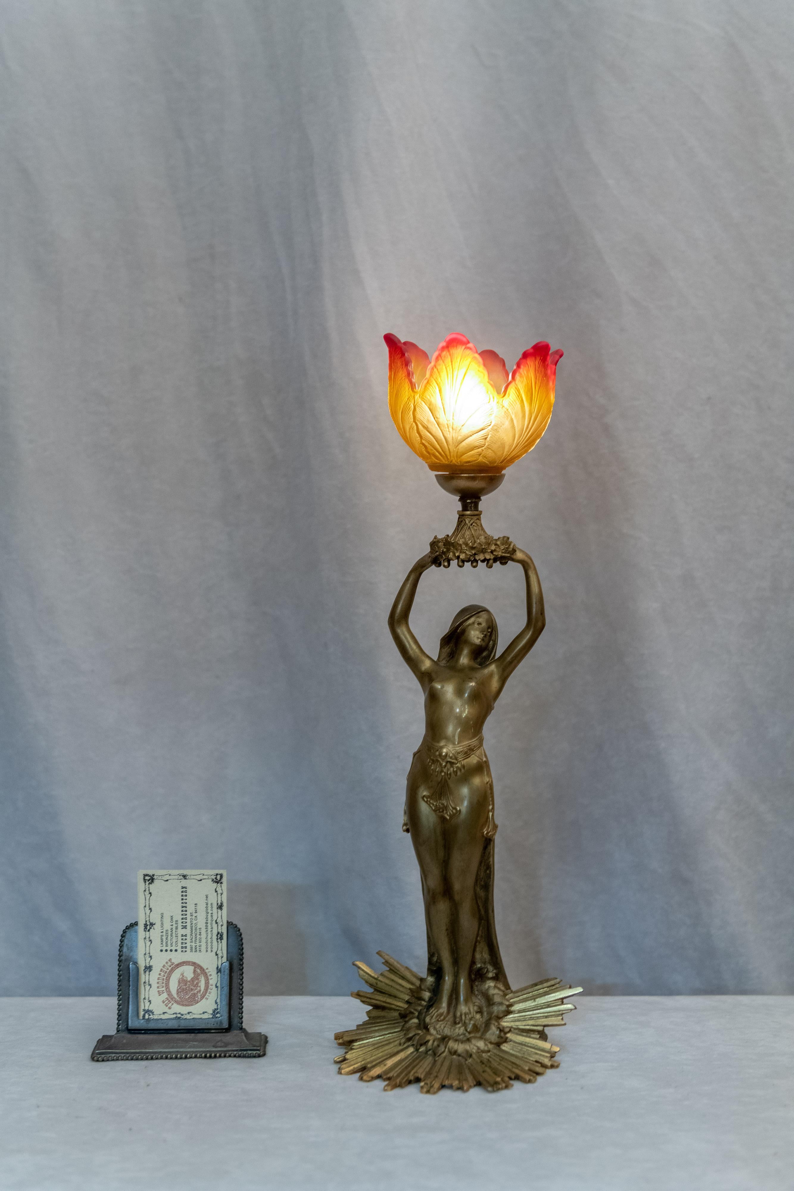 We try to buy the best of our favorite style, Art Nouveau. This figural lamp is a real little gem. Artist-signed A. Fery and we believe it was done circa 1900. The base on which this lovely gal stands is the epitome of the beauty of Art Nouveau.