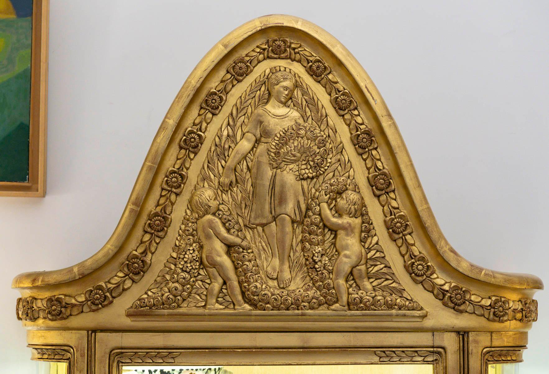 Art Nouveau period giltwood illuminated display cabinet by Emile Bernaux, circa 1910.

Art Nouveau giltwood display case, circa 1910 by Emile Bernaux, signed E.B on the pediment.
H: 208cm, W: 90cm, D: 45cm