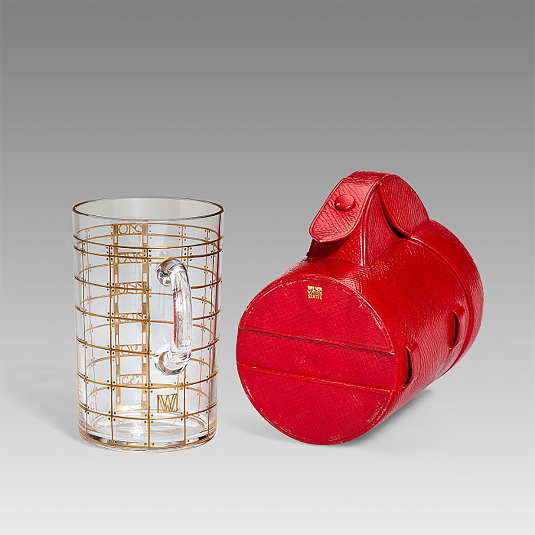 This amazing and rare Art Nouveau glass measuring cup with its matching red leather case has been manufactured by Wiener Werkstätte in Vienna ca 1915 and exemplifies the philosophy of the Wiener Werkstätte: to combine the best design with