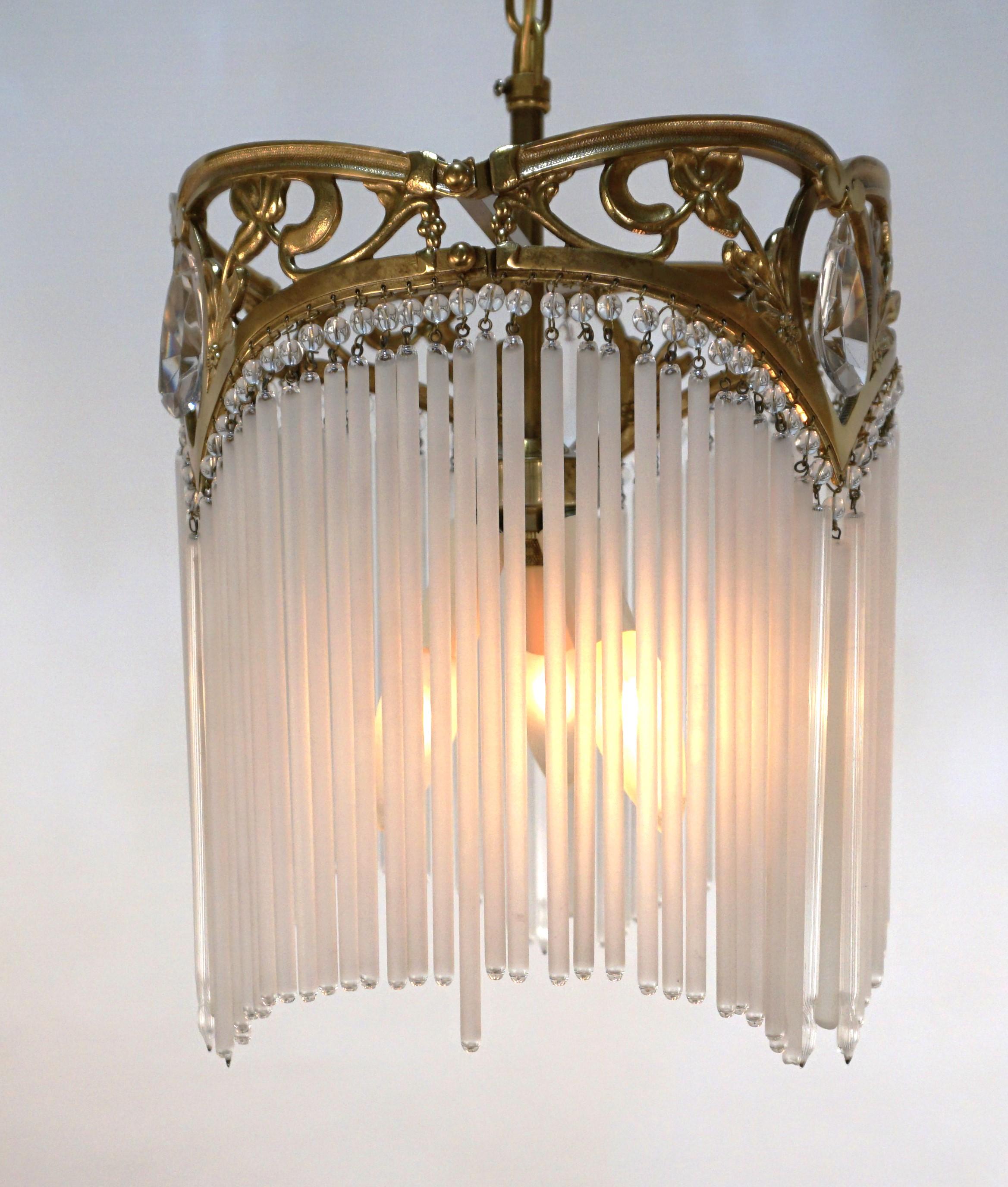 Bronze and glass with clear frost texture glass inserts in style of Hector Guimard.
Very beautiful design.
Professionally rewired and ready for installation, 3 lights 100 max each.