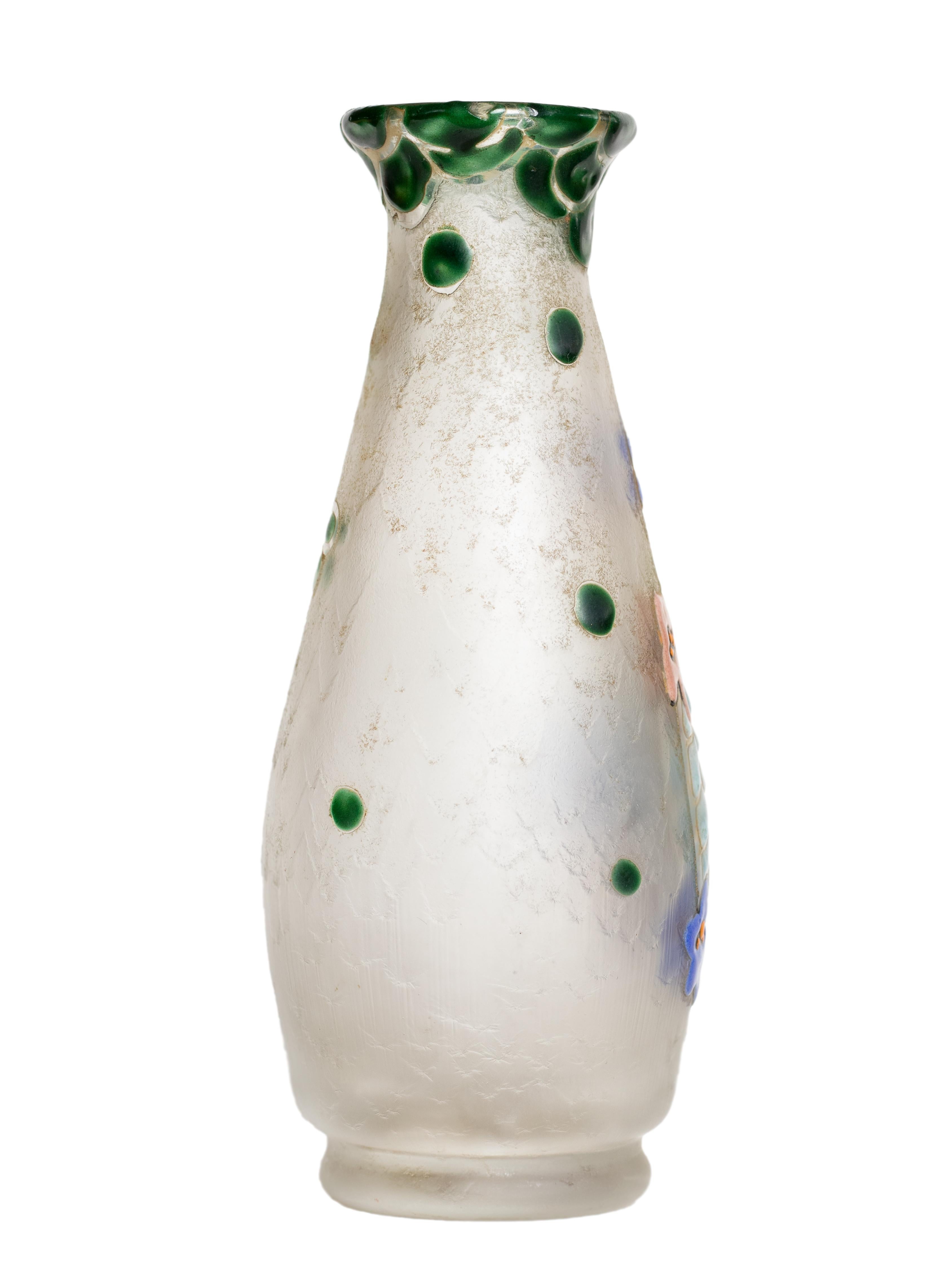This cameo glass vase by the renowned French glassmaker François-Théodore Legras showcases the beauty and craftsmanship of the Art Nouveau period. 
Created in the early 20th century, it features a frosted white background adorned with intricately