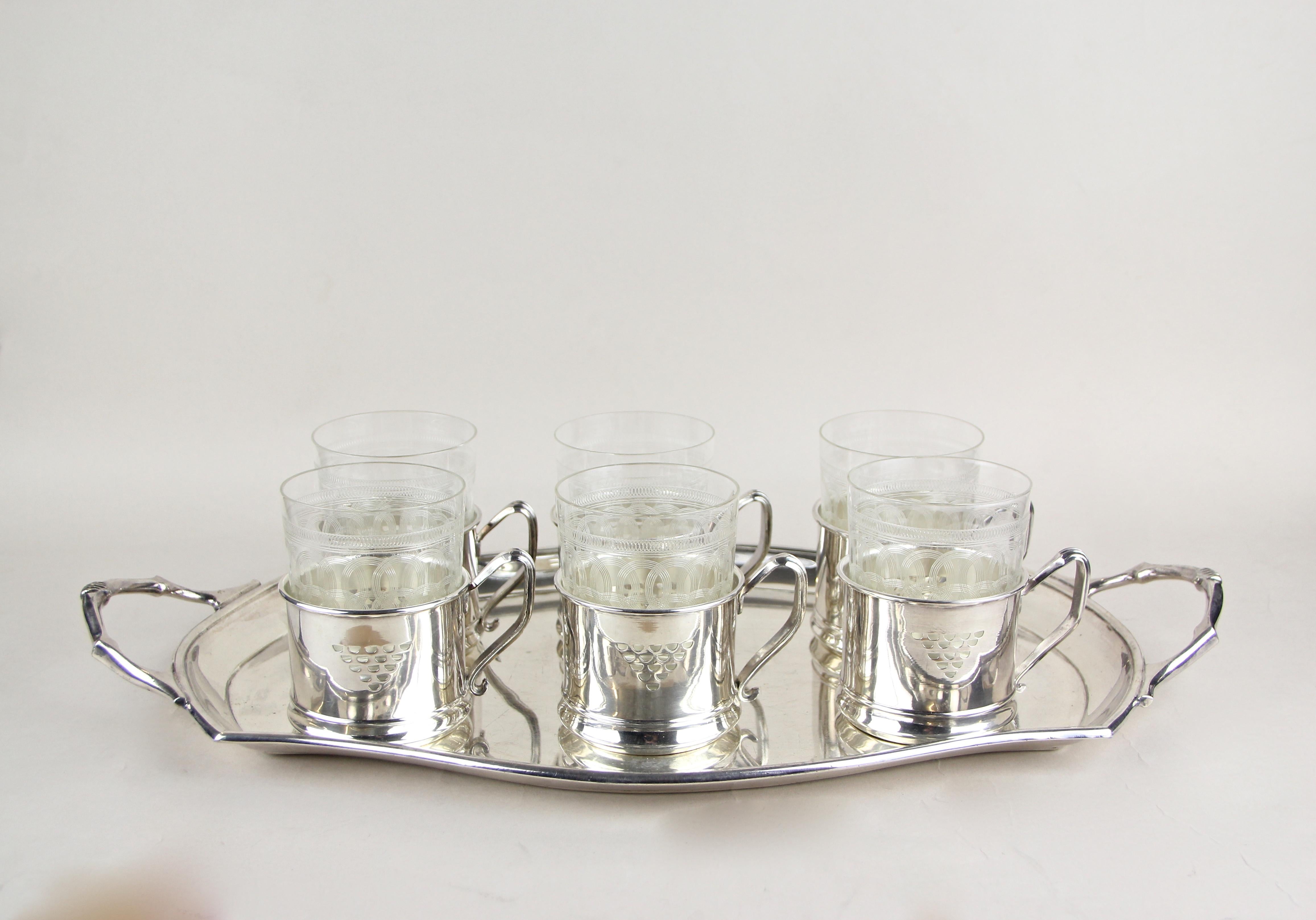 Lovely set of six Art Nouveau glasses on silvered tray by Argentor from circa 1910. Made by the famous company of Argentor in Vienna - Austria, the beautiful engraved glasses show a mesmerizing design and look absolute fantastic in combination with