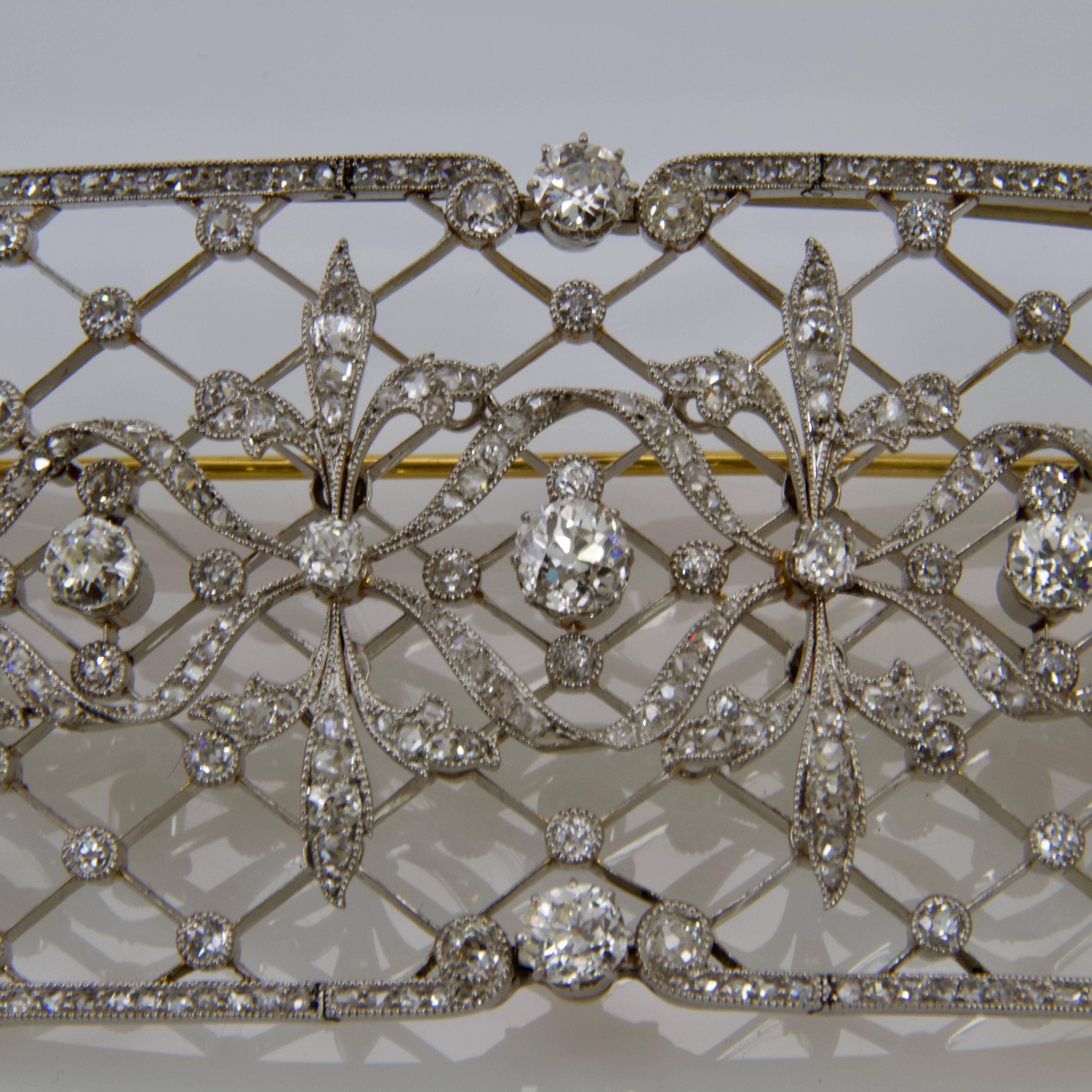 Large unusual gold and platinum stomacher brooch. Openwork structure with latticed decor, leaves pattern in 