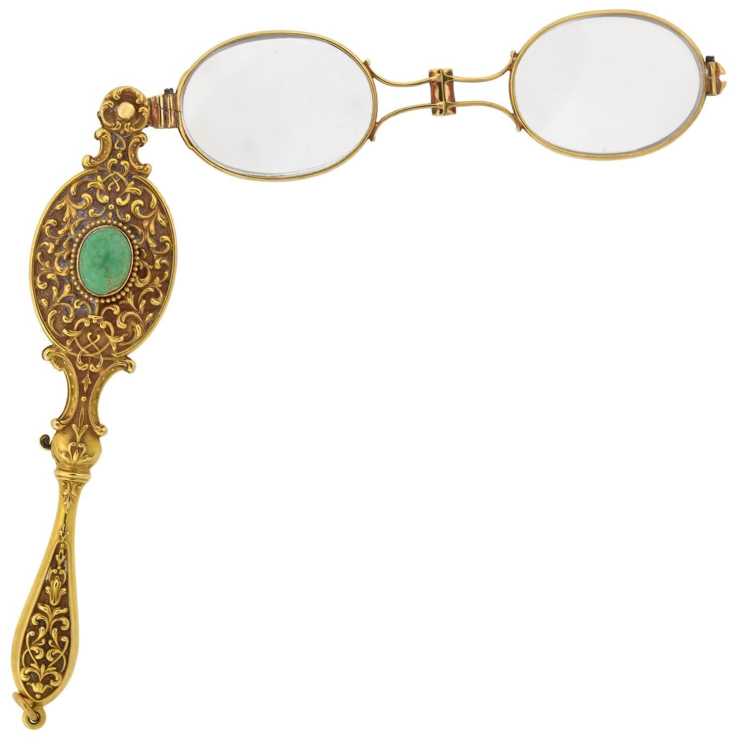 An absolutely fabulous lorgnette from the Art Nouveau (ca1900s) era! Crafted in solid 14kt yellow gold, this incredible piece is comprised of a pair of folding glasses held within a breathtaking textured lorgnette encasement. The lorgnette is