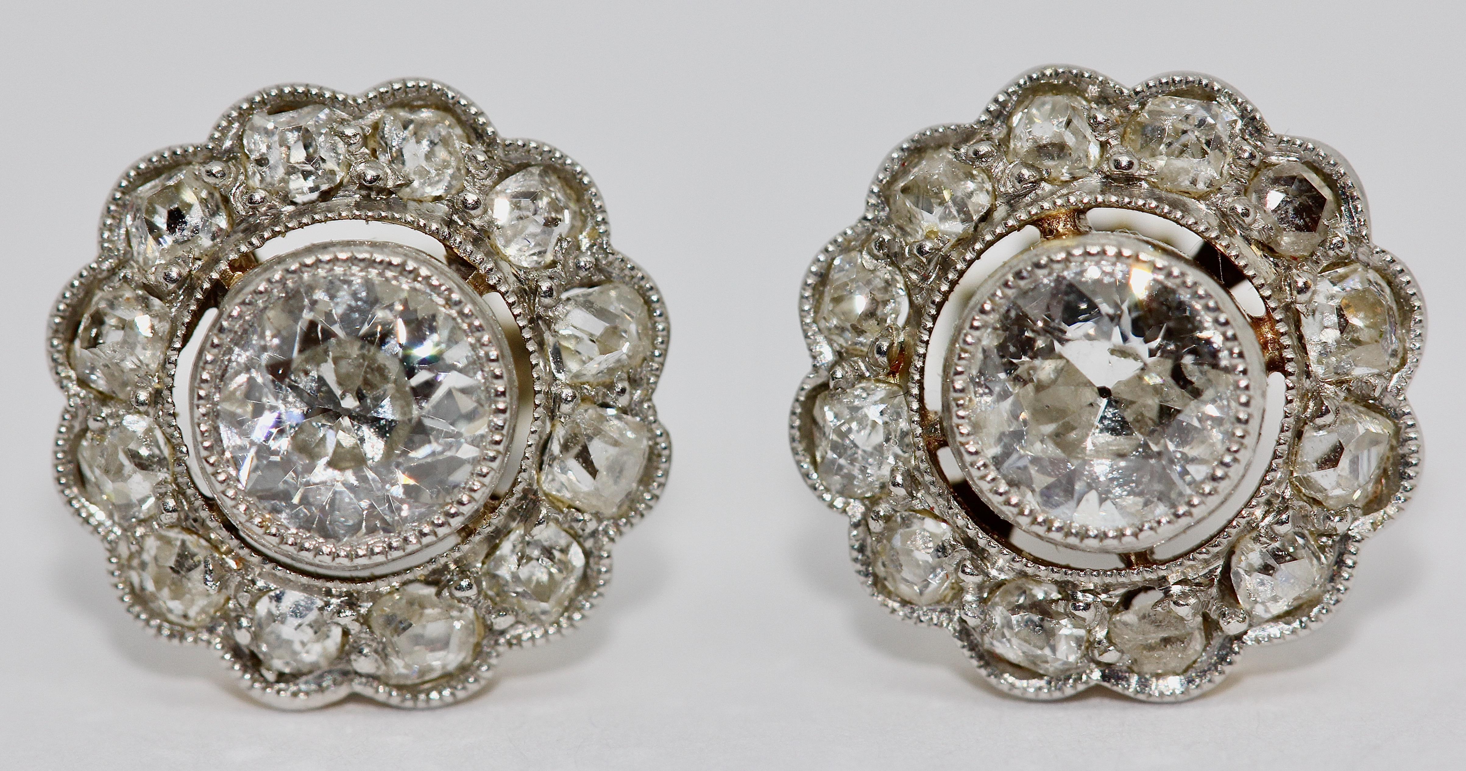 Pretty Art Nouveau Gold Diamond stud earrings.

Large diamond solitaire approx. 0.33 carat each.

Including certificate of authenticity.