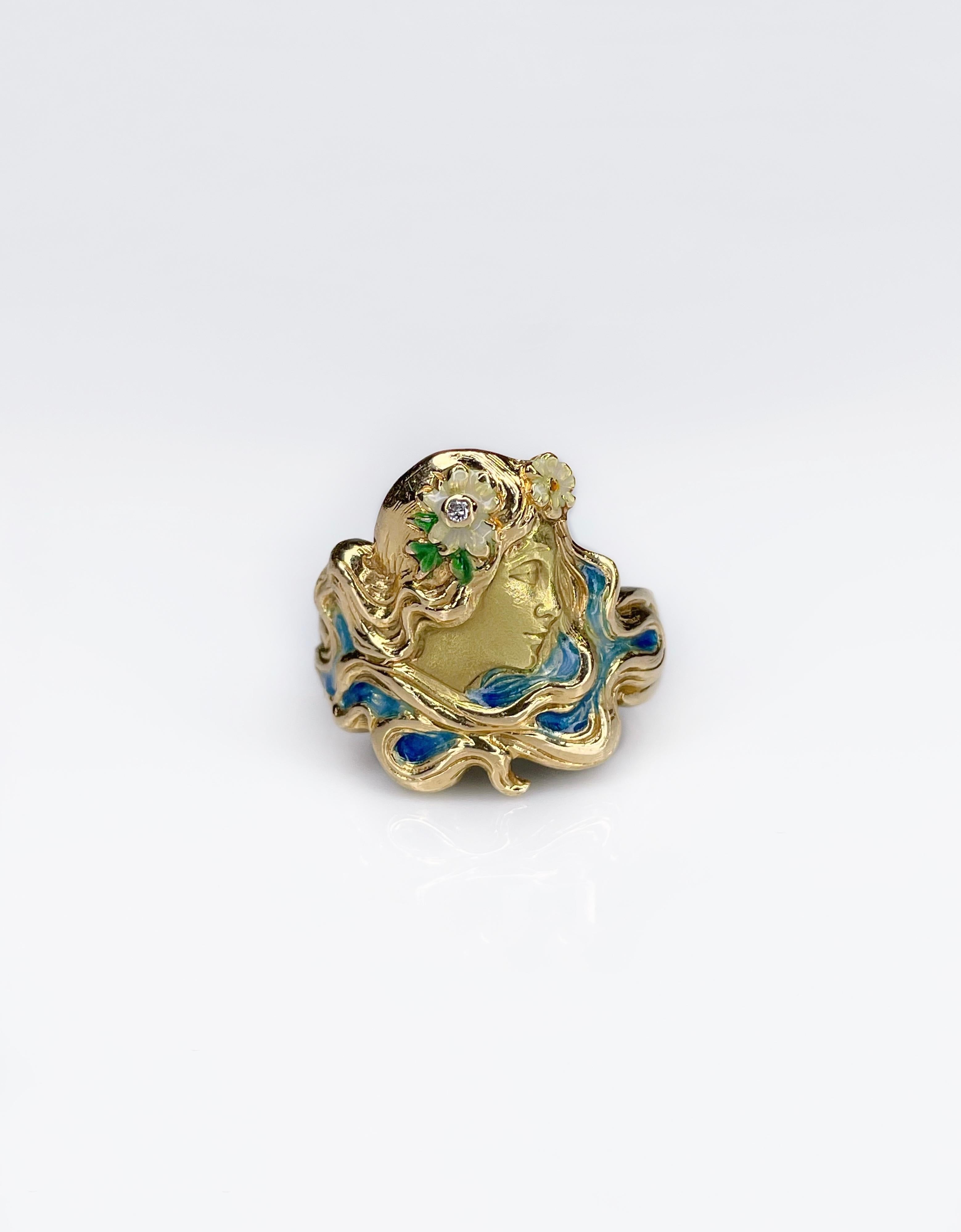 This rare Art Nouveau daisy goddess ring has been crafted in 18K yellow gold. Period is the beginning of XX century. This stuning ring is decorated with blue, green and white colored enamel. Symbolic Daisy Goddess wears a flower with a brilliant-cut