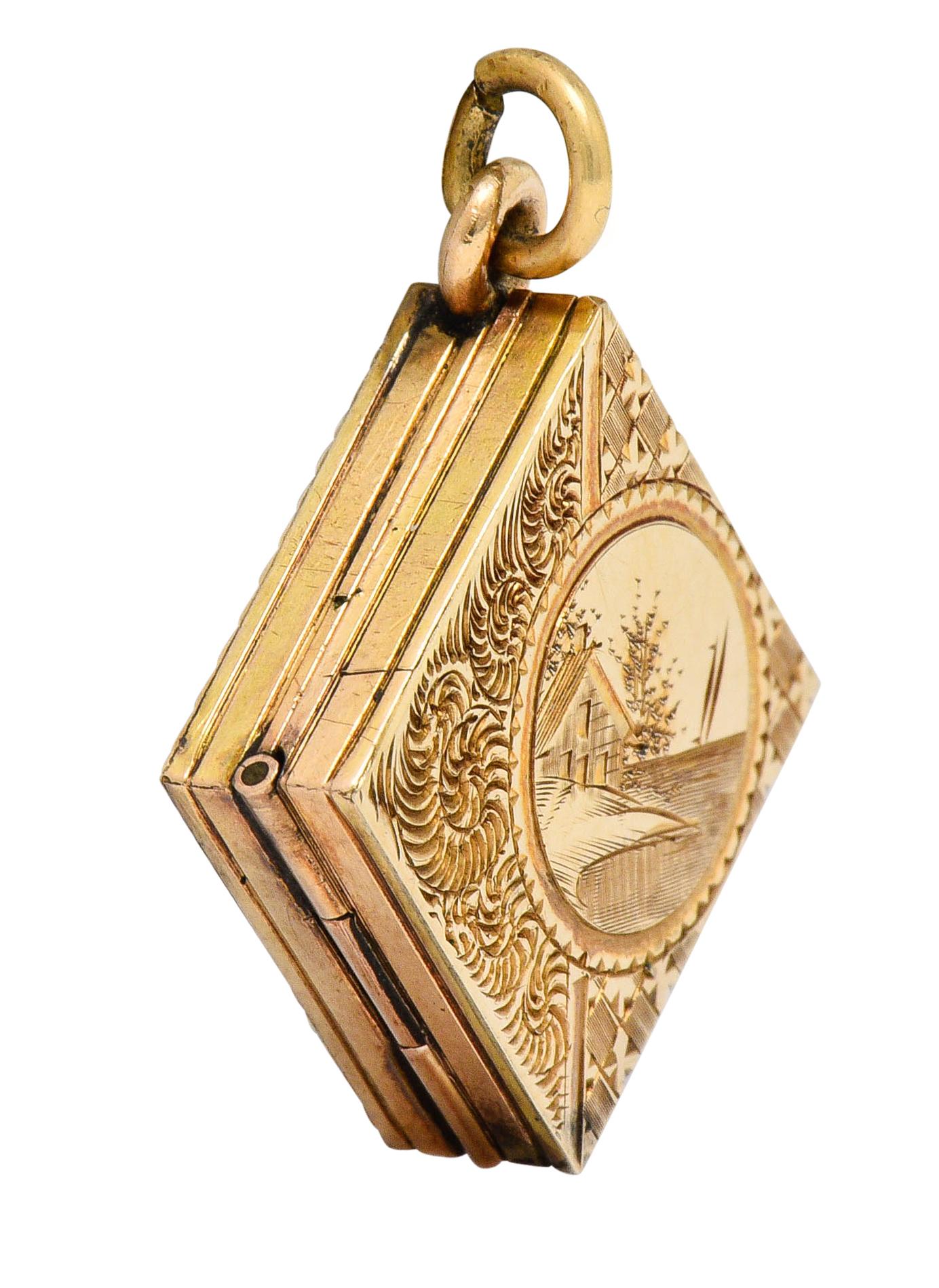 Square shaped locket deeply engraved to depict a lake-house landscape

Accented by deeply ribbed volutes and floral details

While back features a ridged border and the monogrammed initials 'G.T.'

Opens on a hinge to reveal two square recesses,