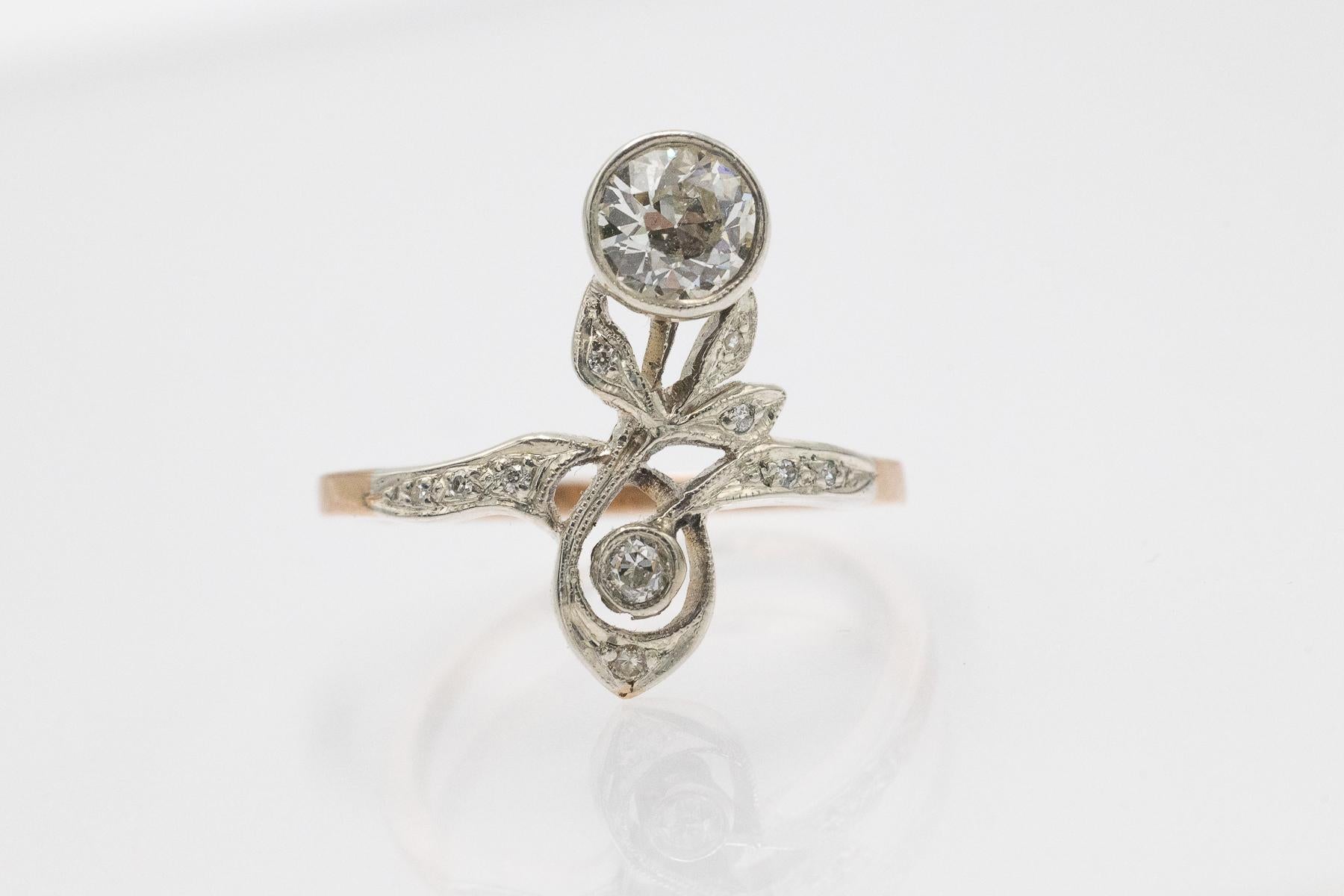 A vintage gold ring in the shape of a flower, crafted from 14-karat yellow gold and silver elements set with diamonds.

Origin: Austria-Hungary, Pest, circa 1900-1910.

This beautiful gold Art Nouveau ring from the Austro-Hungarian Empire captivates