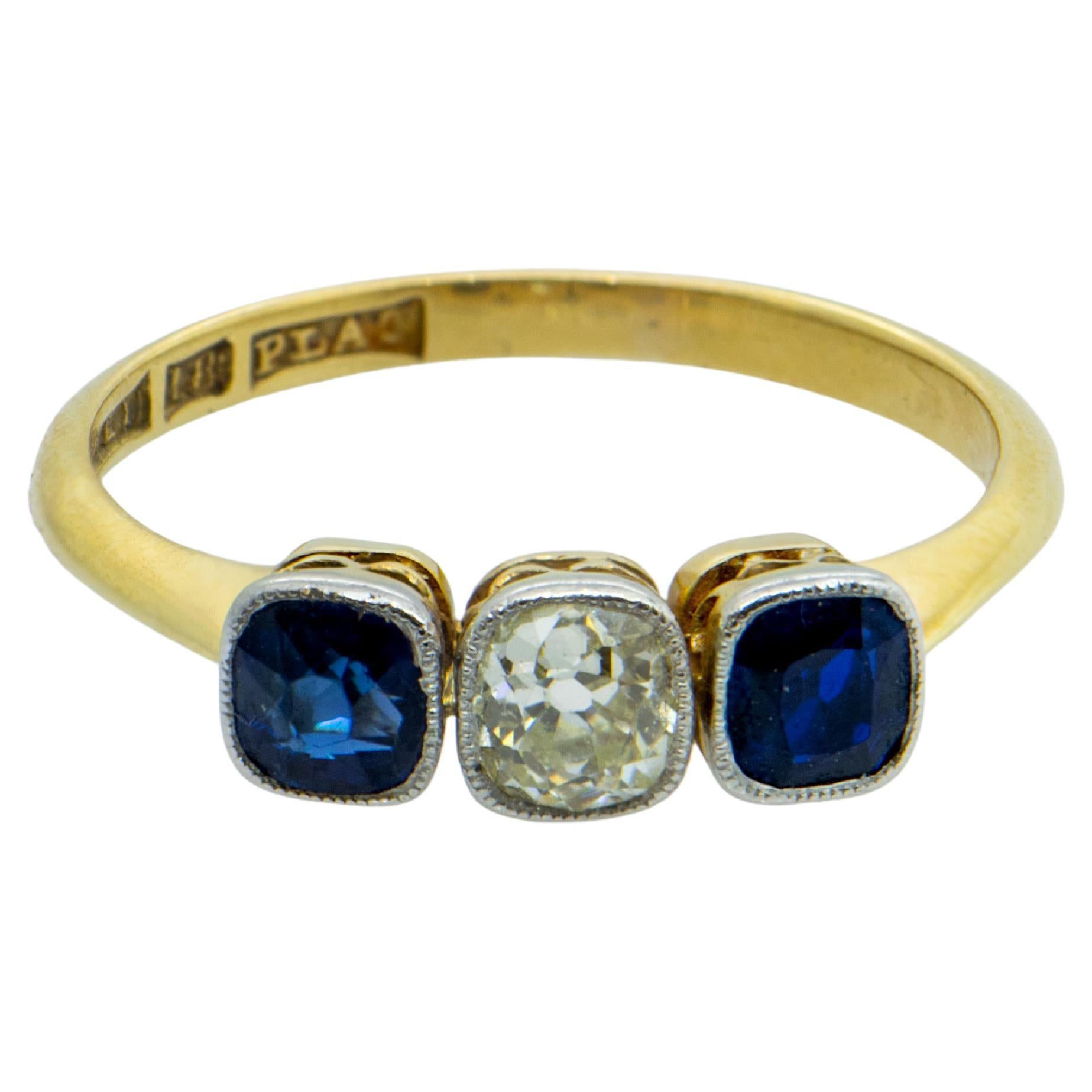 Art Nouveau Gold Ring with Cushion Cut Diamond and Two Cushion Cut Sapphires For Sale