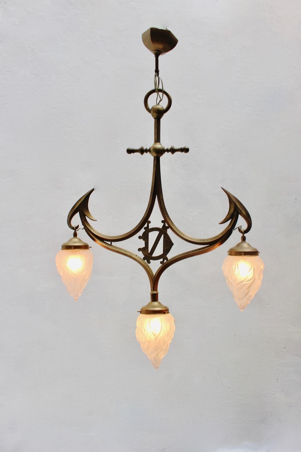 Art Nouveau Gothic Revival carved brass & glass 3-light pendant lamp, Spain, 1910s.
In very good condition with light patina due to age and use.
 