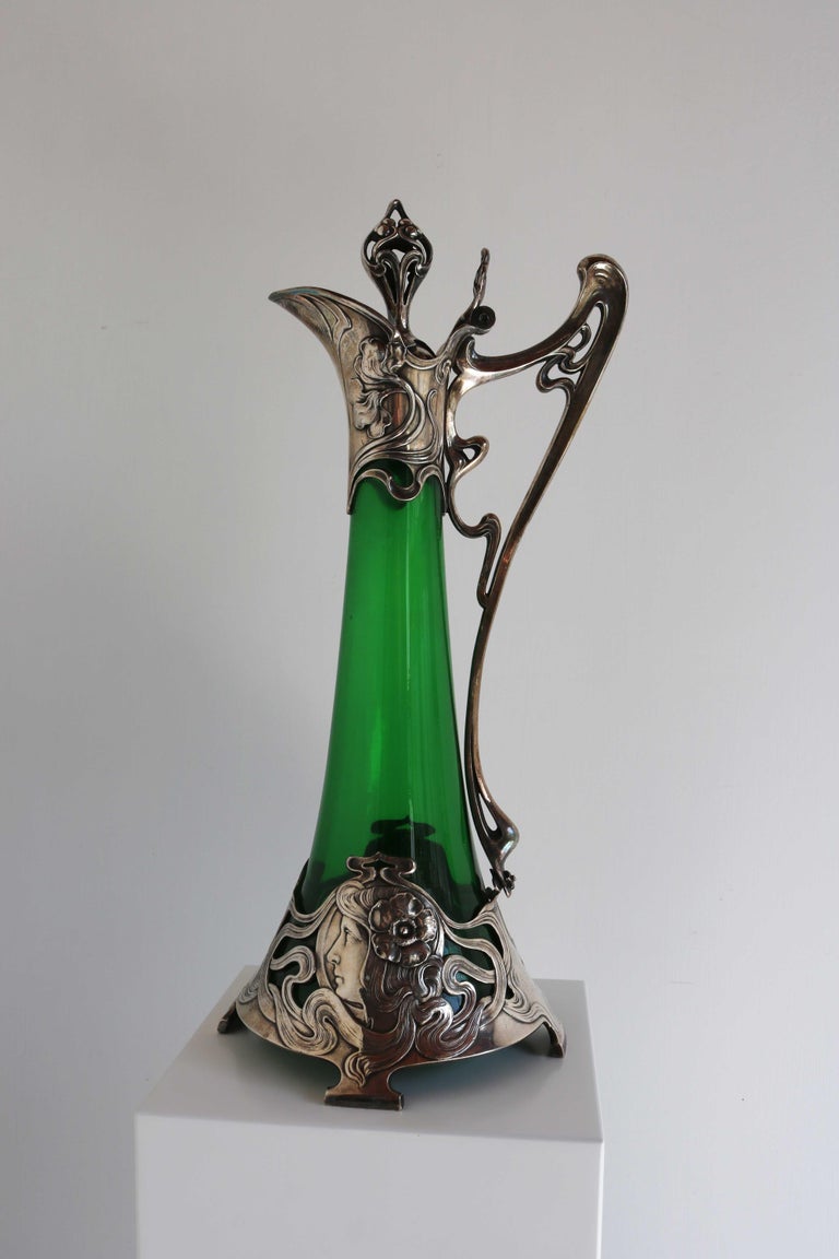 Exquisite German Silver Plated Art Nouveau Decanter / Pitcher by WMF Green Glass 1900

Gorgeous German antique Art Nouveau decanter / pitcher in silver plate with green glass by WMF. 1900  Exquisite Art Nouveau design and chic color combination,