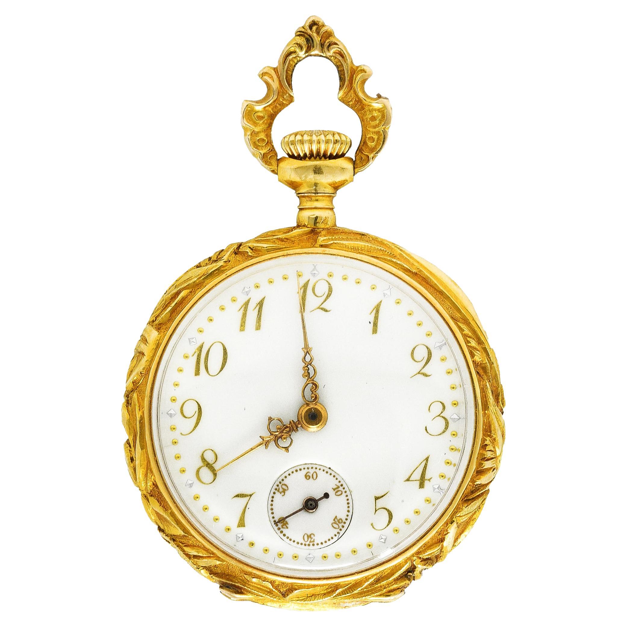 Antique pocket watch features a highly rendered depiction of a dragonfly amongst cattail foliate

Set with diamonds, demantoid garnets, and rubies - weighing collectively approximately 0.75 carat

Rendering is pierced and backed by a radiating