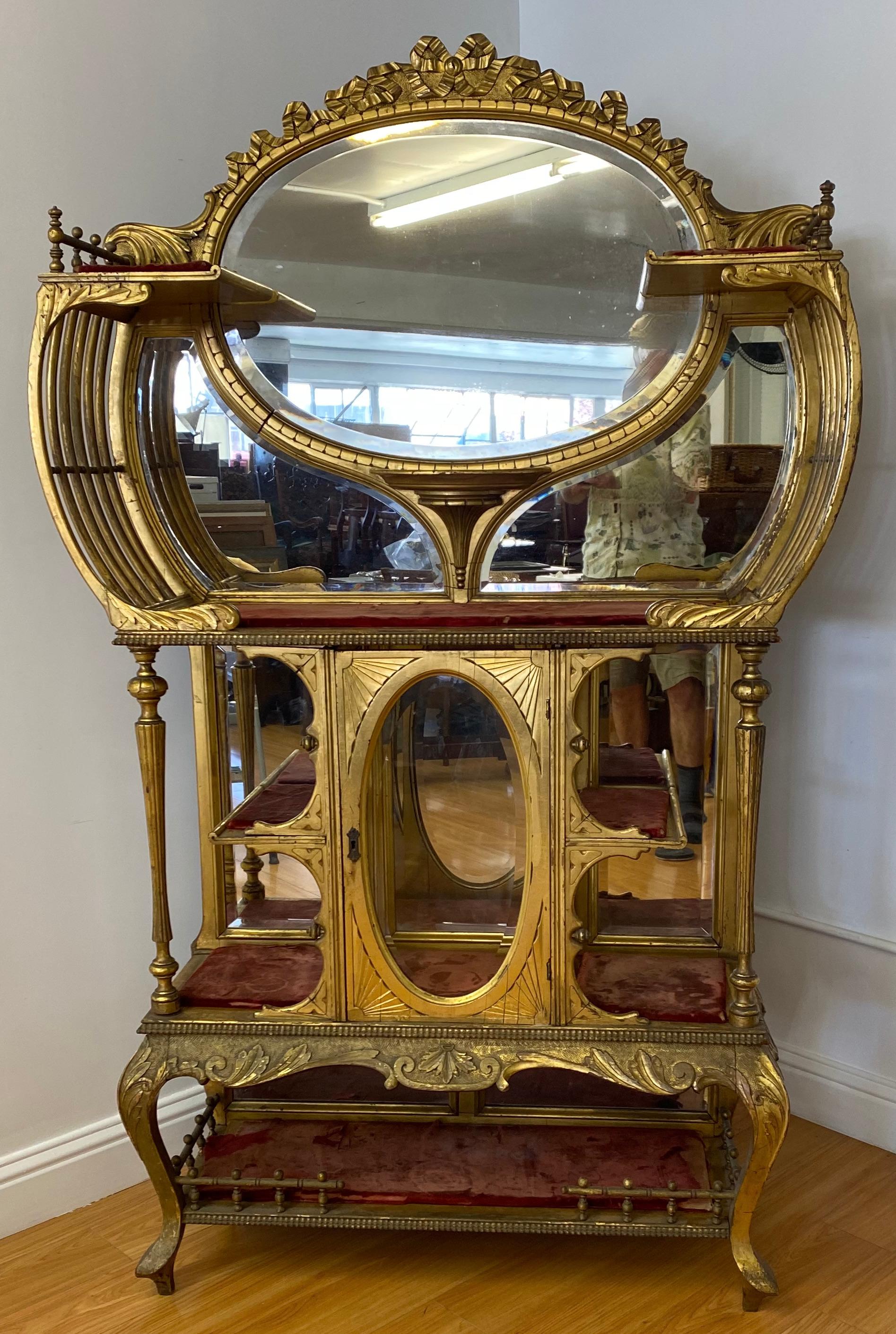 Art Nouveau hand carved & gilded etegere, Circa 1890-1910

Gorgeous late 19th to early 20th century carved and gilded etagere

Ample remains of the original gilding remain

The shelves have removable inserts that you can cover with fabric. The