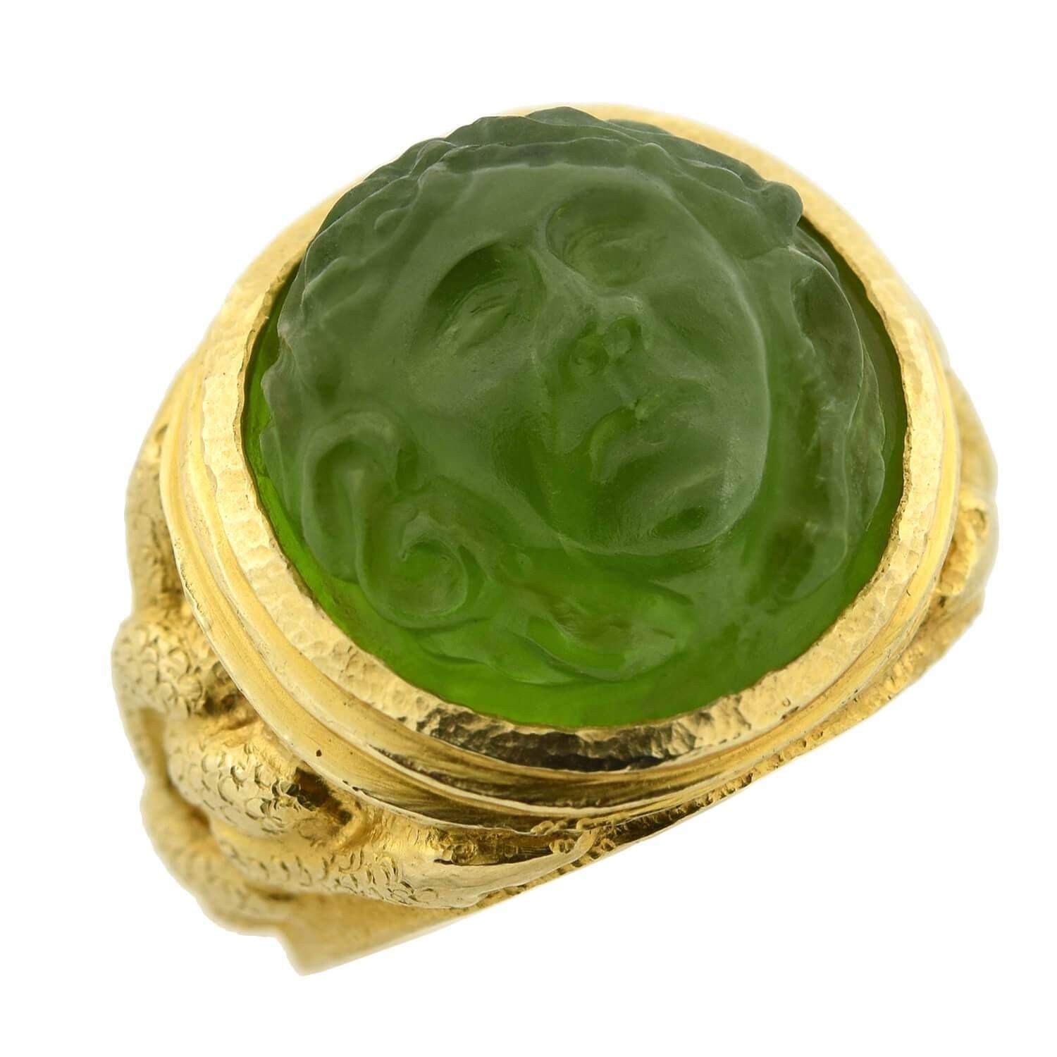 A stunning and unusual tourmaline ring from the Art Nouveau (ca1910) era! This alluring piece is crafted in 14kt yellow gold and features a single tourmaline cameo bezel set in the center. The tourmaline, which is substantial in size, is round in