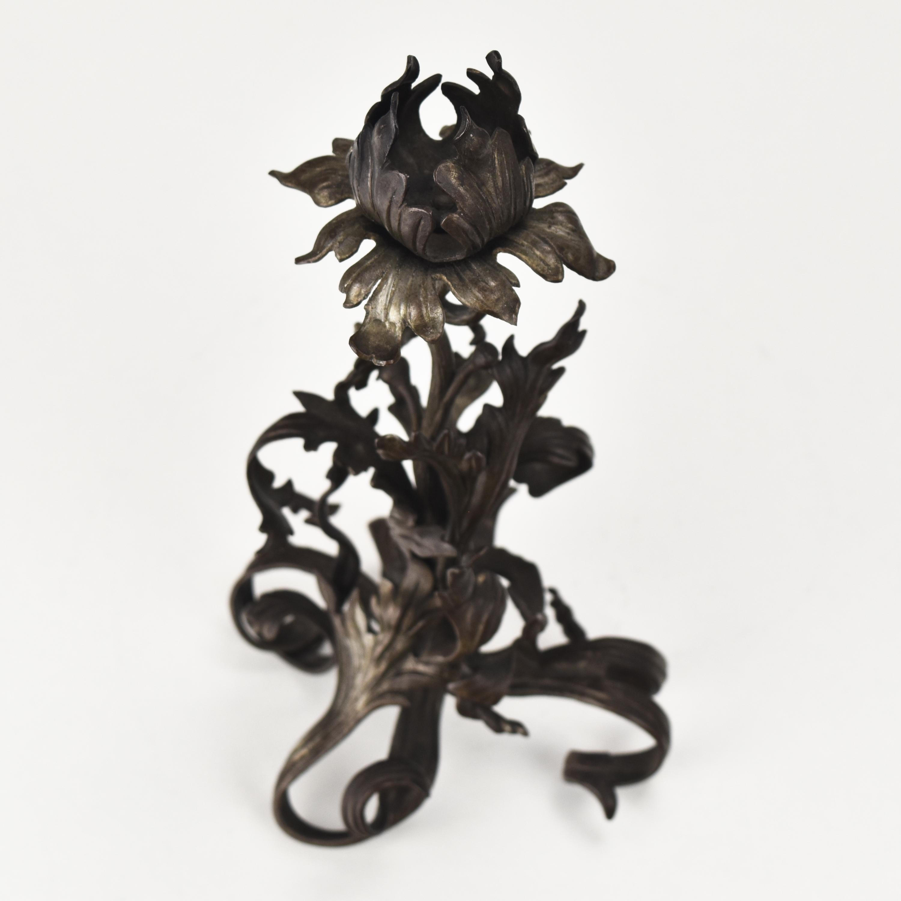 This hand-forged candle holder is an exquisite piece of the Arts & Crafts era. It depicts a thistle, and its design is attributed to the Ecole de Nancy made during the Art Nouveau period.
The candlestick resembling the works of Louis Majorelle,
