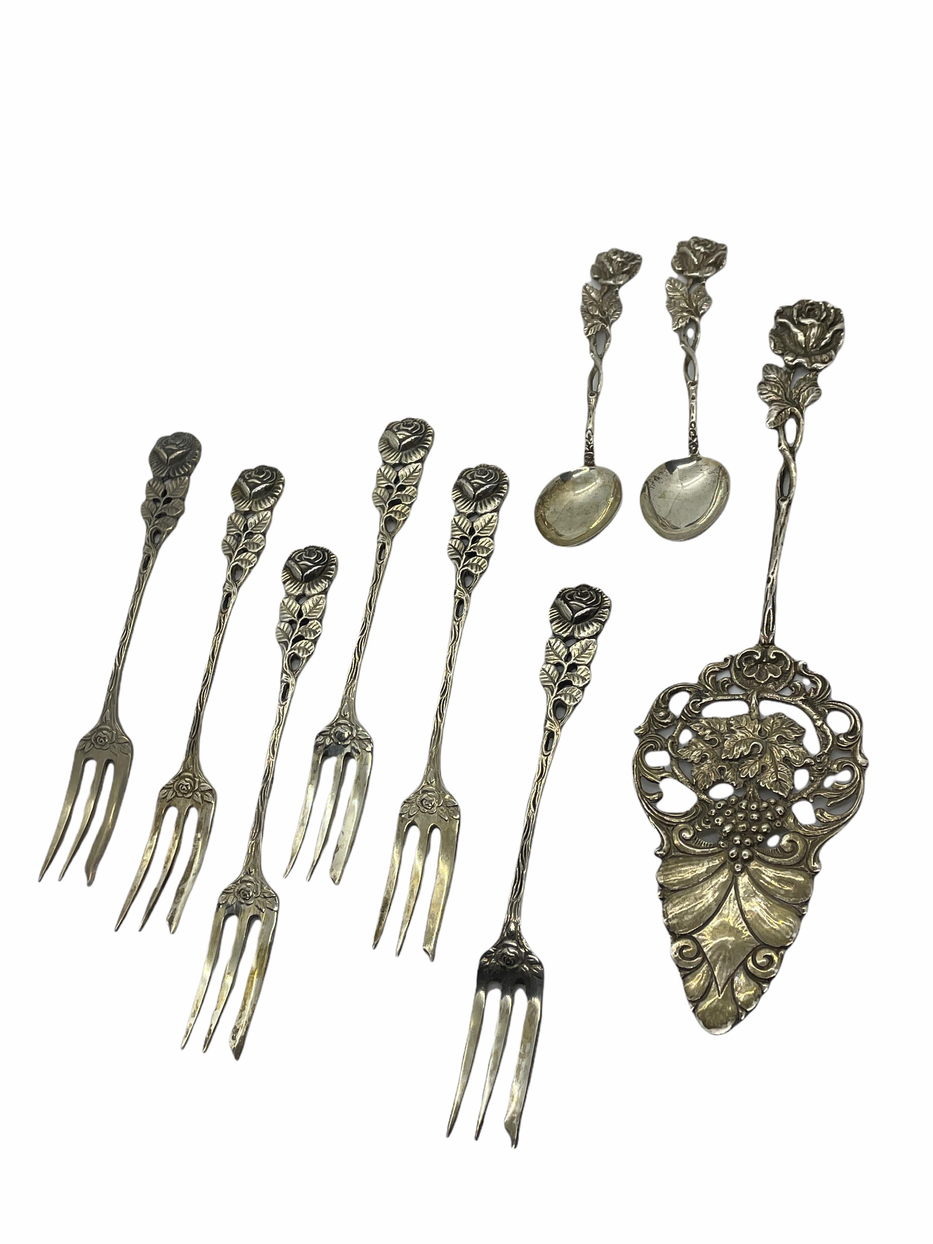 A beautiful Art Nouveau flatware set of 6 cake forks, 2 sugar spoons and a cake shovel. Made of silver spoons and forks 0.800 and shovel 0.835, it will make a nice addition to any table. Its total weight can be seen in the pictures. Forks 5 3/8