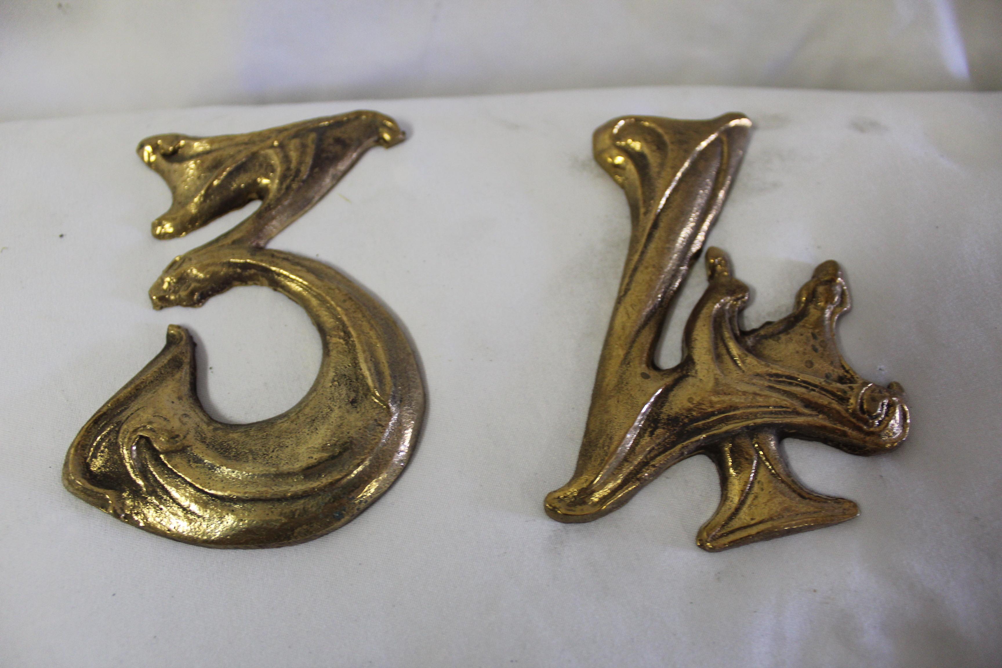 Art Nouveau bronze numbers cast in bronze from the design of Hector Guimard from France.  They are priced ( Each )  We have many of them . Let us know which one's you are interested in .   Very rare to find these .  Not drilled Discount for quantity