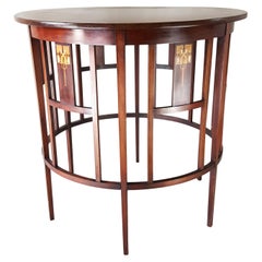 Art Nouveau inlaid mahogany centre table  attributed to J S Henry