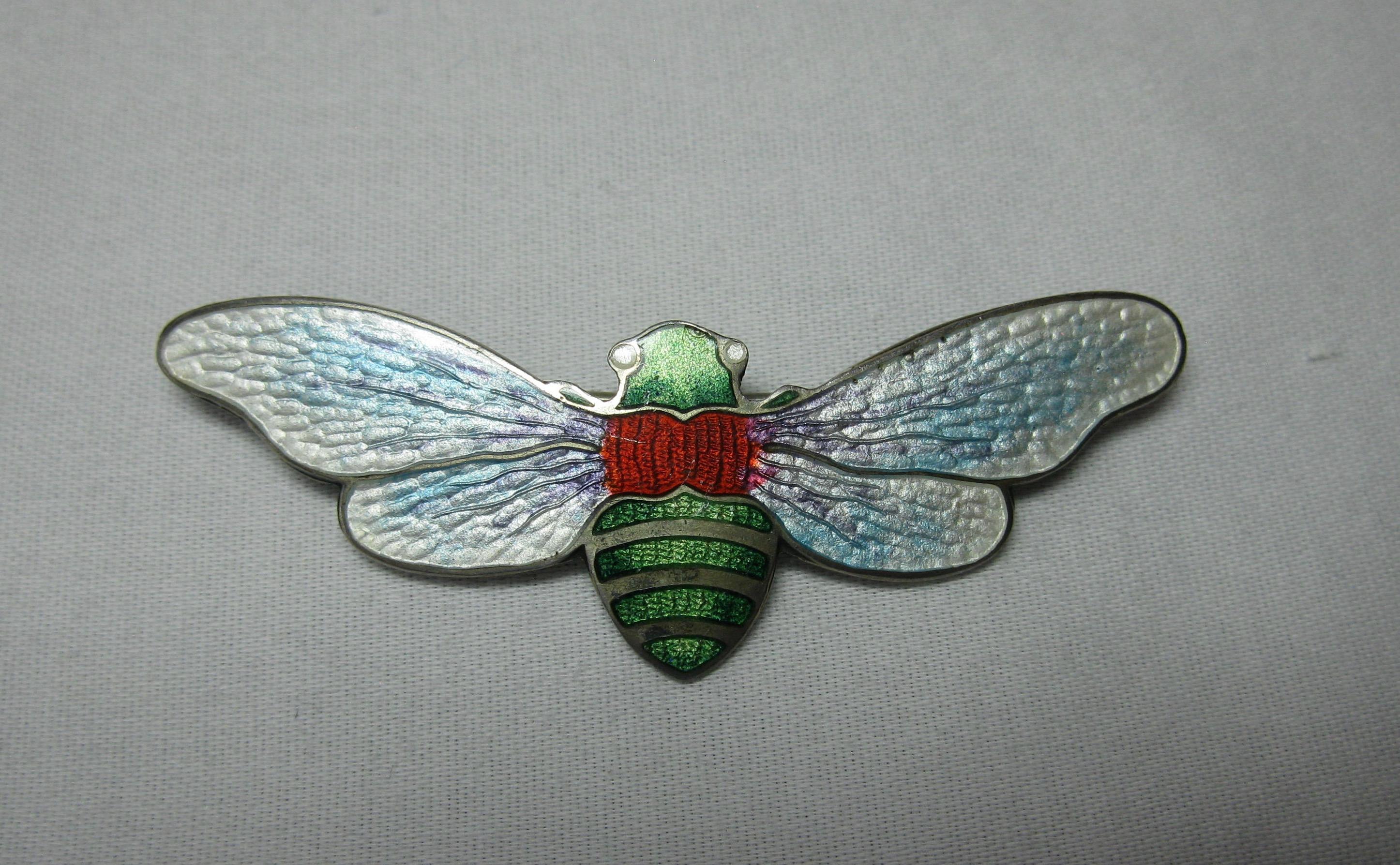 A stunning Art Nouveau Insect Moth Cicada Brooch Pin with extraordinary iridescent guilloche enamel set in Sterling Silver.  The hand painted enamel work is the creation of a master Art Nouveau artisan with stunning iridescent blue and white wings. 