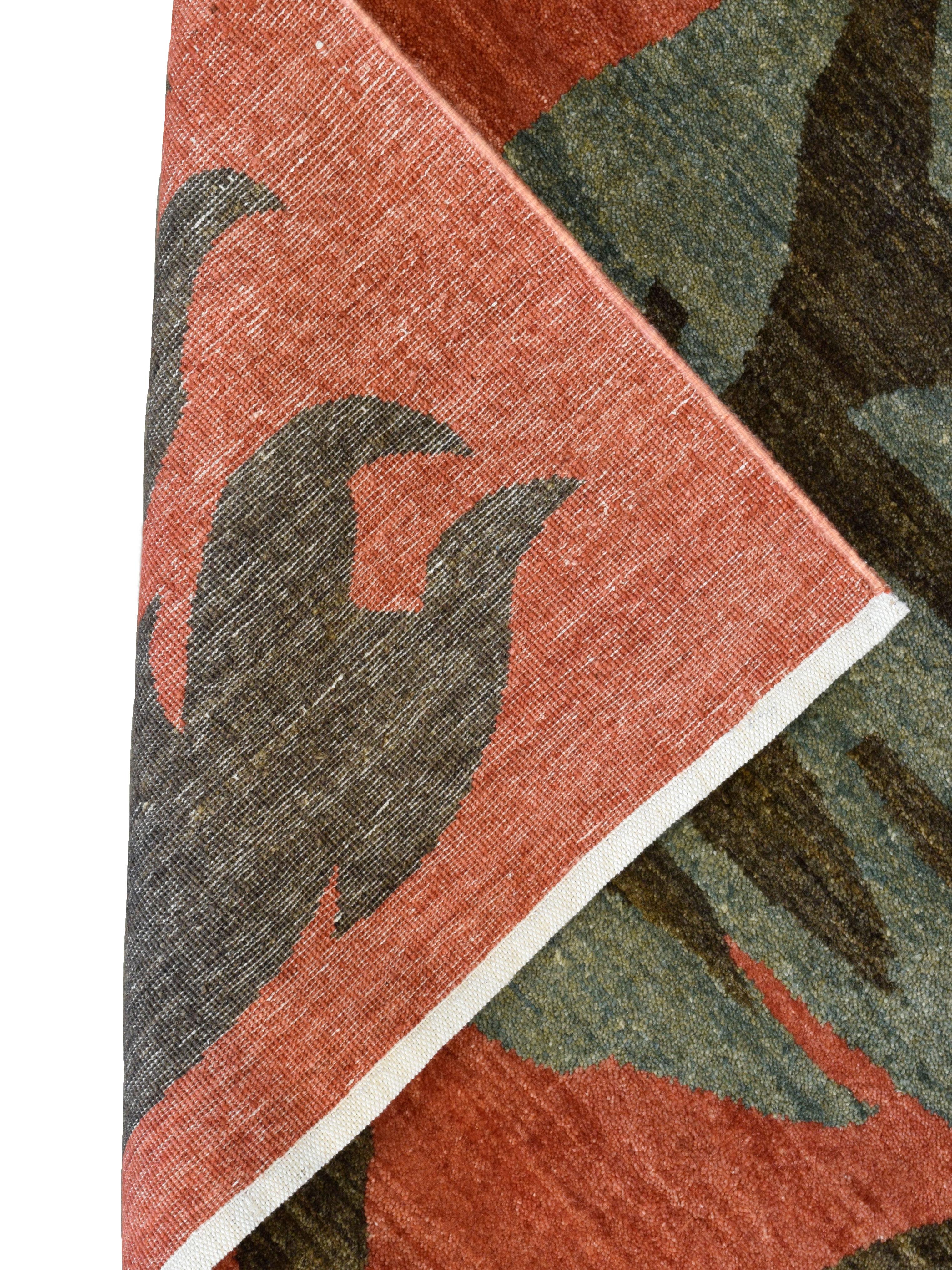 This Art Nouveau–inspired hand-knotted Persian wool rug, measuring 4' x 6', showcases a flowing botanical composition rendered in rich, earthy tones. Set against a warm red ground, stylized vines, leaves, and organic fruit-like forms unfurl across