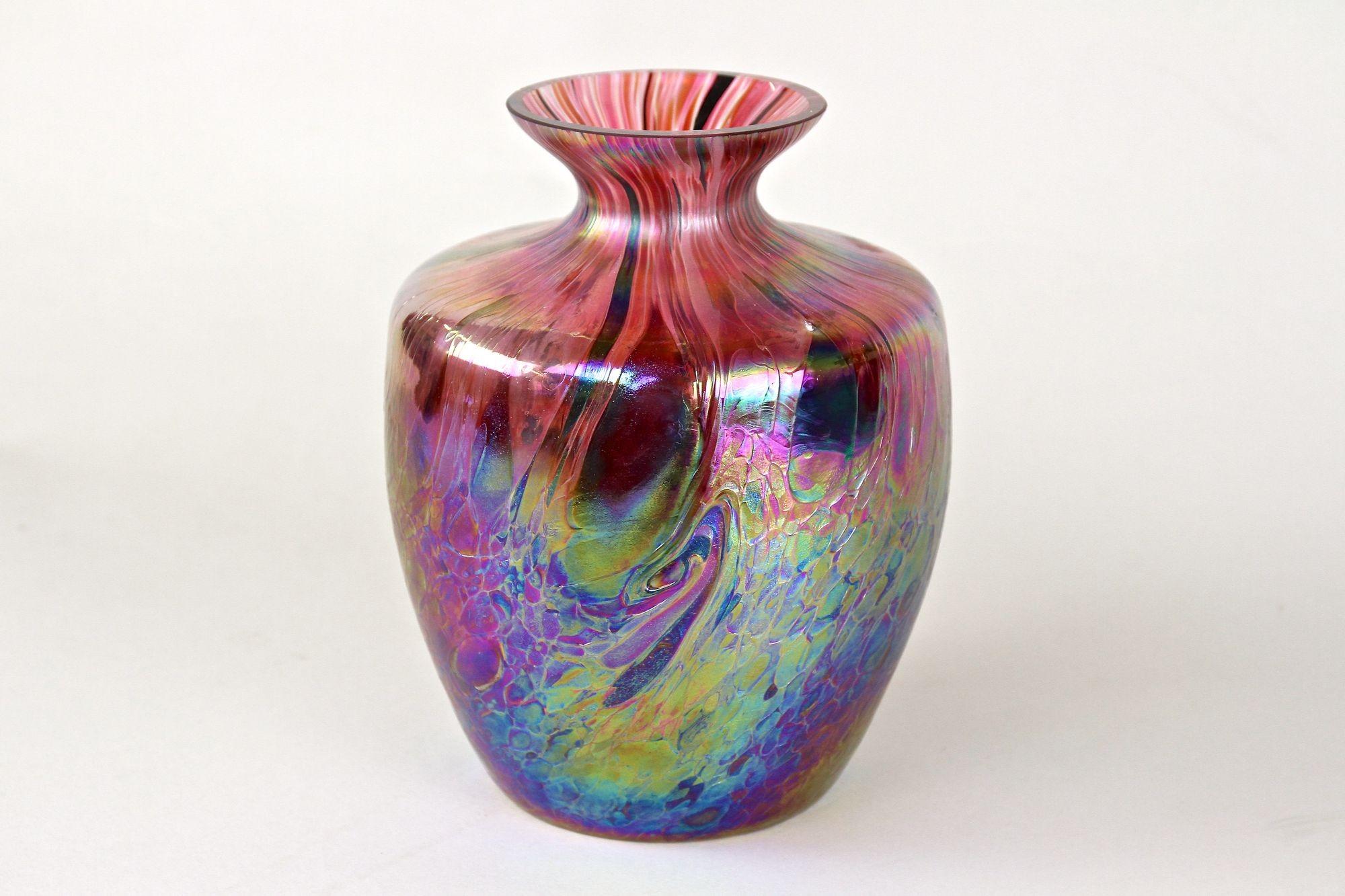 Breathtaking, large iridescent Bohemian glass vase from the Art Nouveau period around 1905. The absolute extraordinary, bulby shaped glass vase, attributed to Fritz Heckert, impresses with its one of a kind shimmering multi-colored surface.