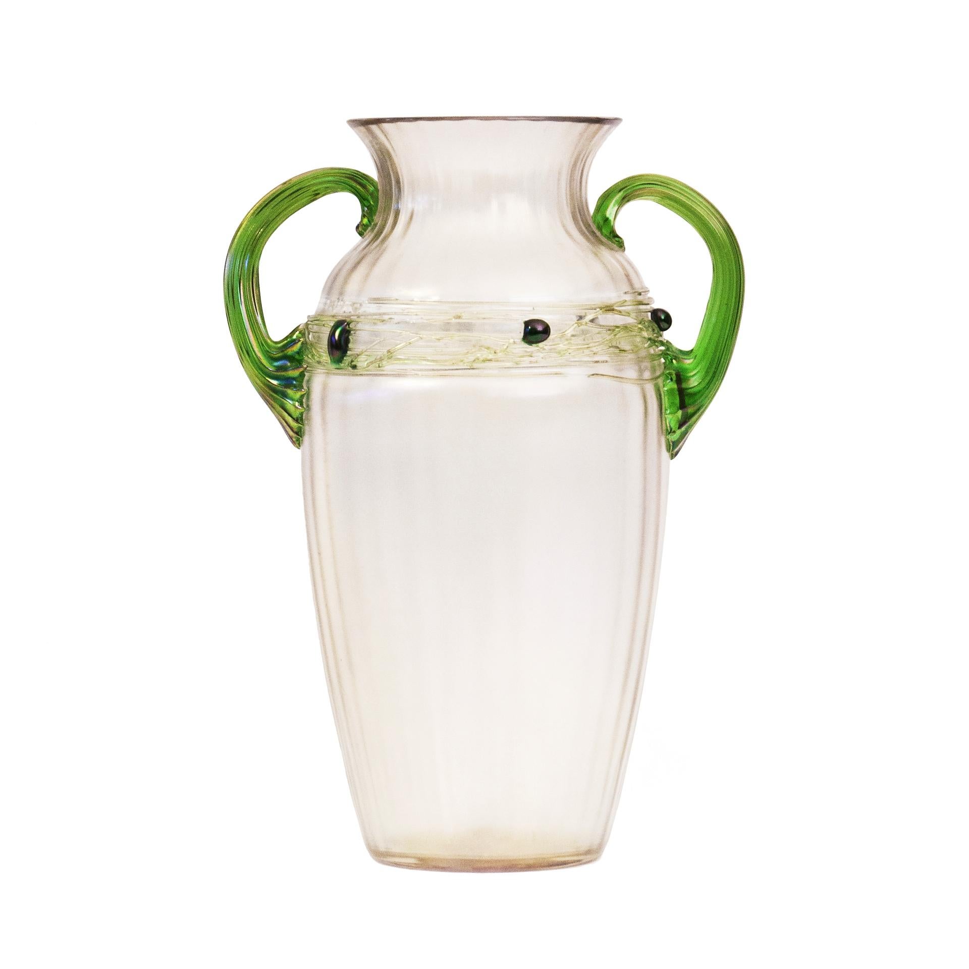 This is a sophisticated example of an iridescent vase by Wilhelm Kralik, one of Art Nouveau’s most eminent glasswork labels. The products of this company were characterised by original design, experimenting with texture and high-quality