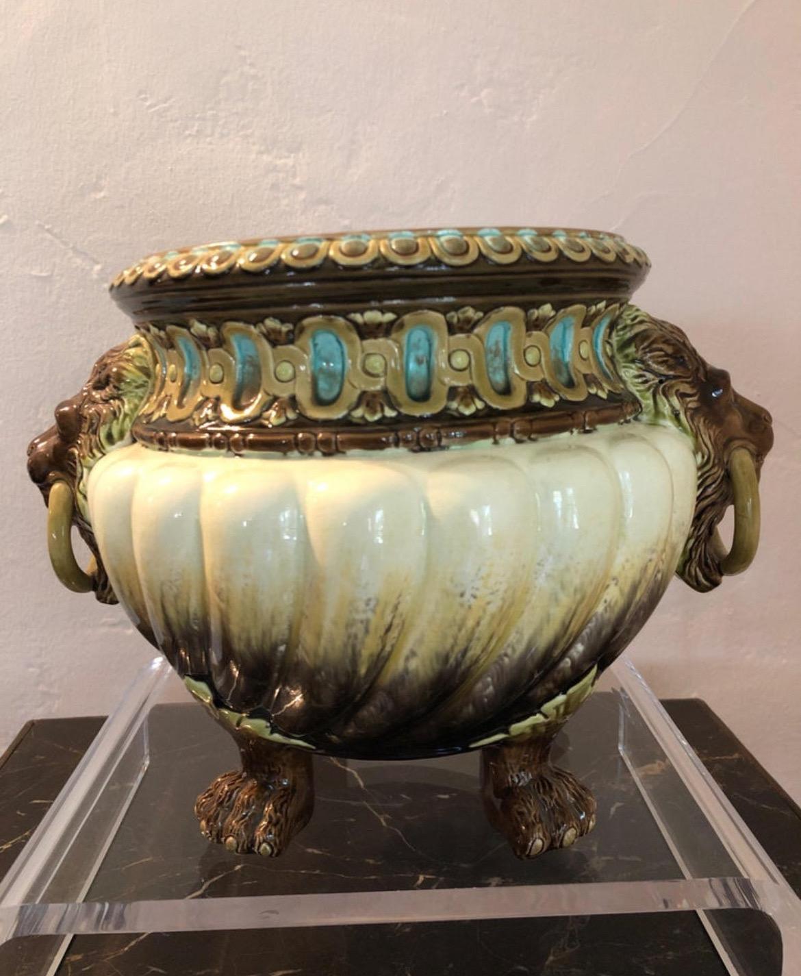 Eye-catching Art Nouveau jardinière by Julius Dressler.
Stamped and numbered on bottom. 

Gorgeous shades of greens, teal and brown with lion heads holding rings. 

Beautiful representation of Majolica.