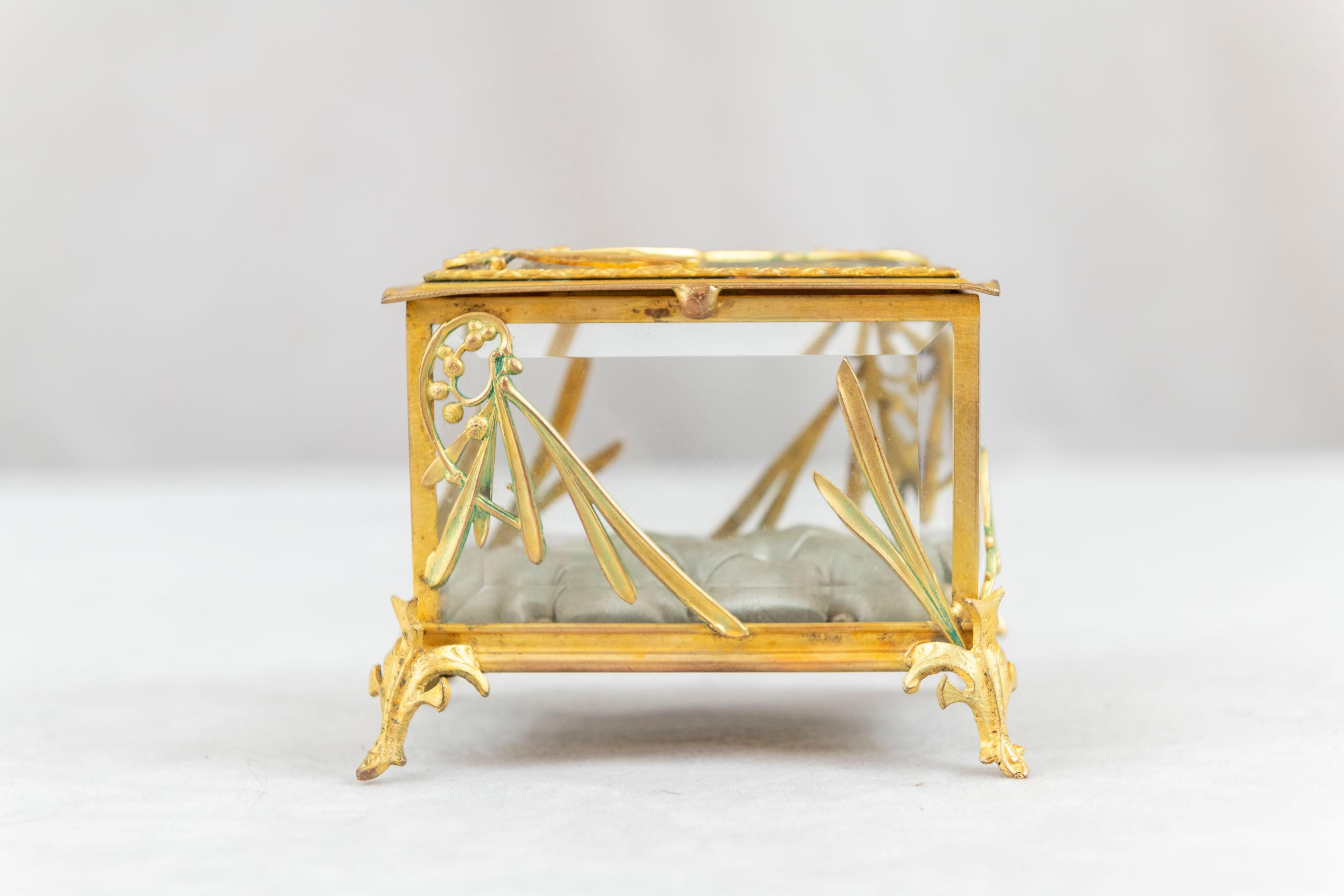  A very high quality art nouveau French gilt bronze ring box. All the glass is beveled and the inside is tufted silk. A striking and rare little item. A perfect gift for the engagement ring, or good for any occasion. A very special gift.