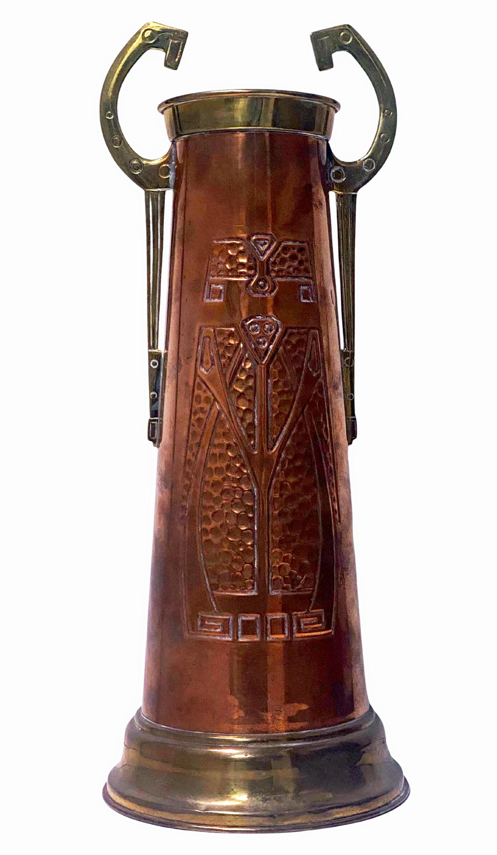 Art Nouveau Jugendstil Copper and Brass large Vase, probably Germany C.1900. Embossed hammered mottled design on copper body with stylised brass handles, the base and upper rim in brass. Condition: slightly out of shape at base, nothing that could