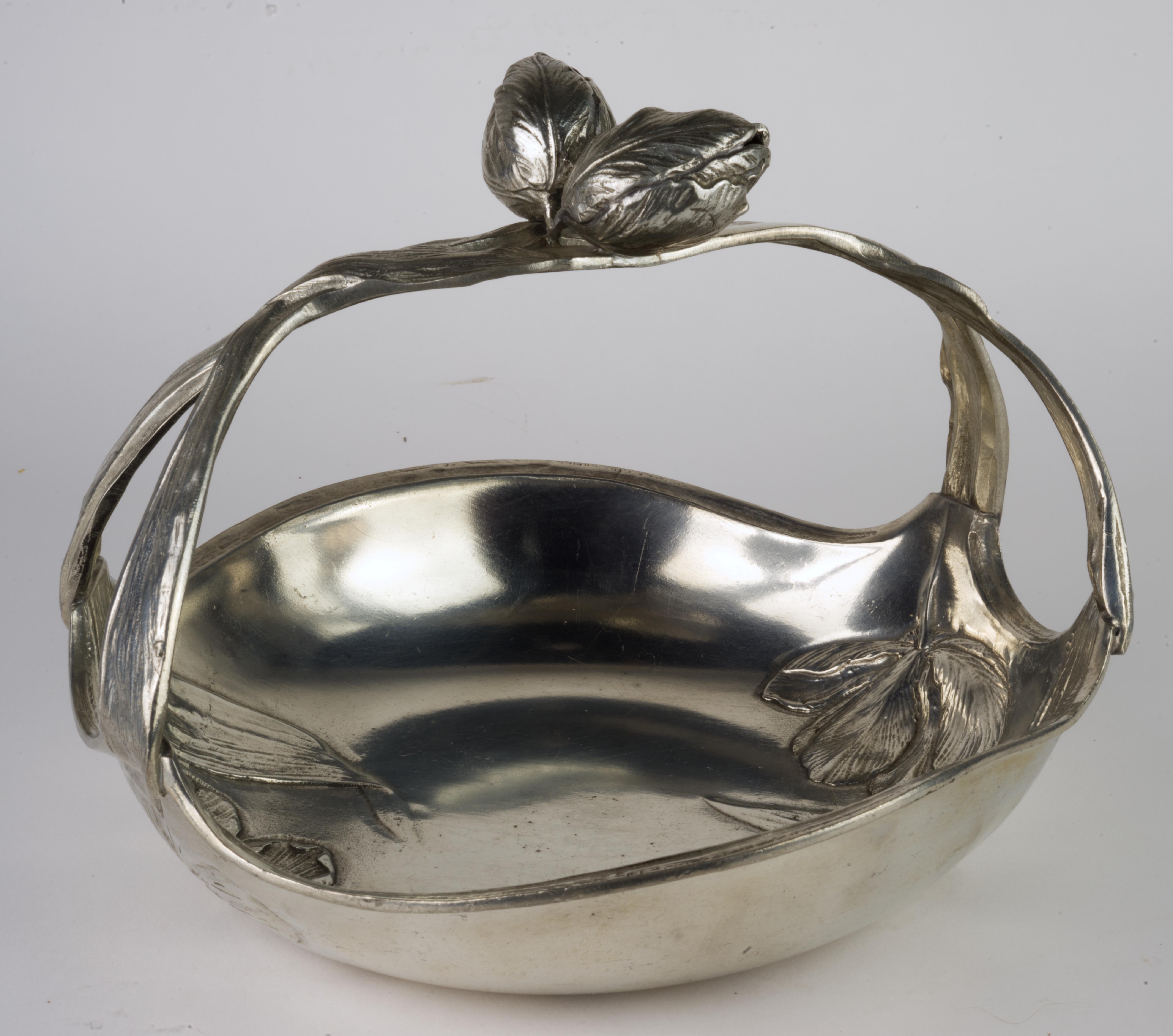 Art Nouveau Figural Basket is decorated with figurative tulips; the double handle has two unopened tulips on top. Baskets with very similar designs are documented in online catalogues and auction listings, signed with Achille Gamba stamps, with date