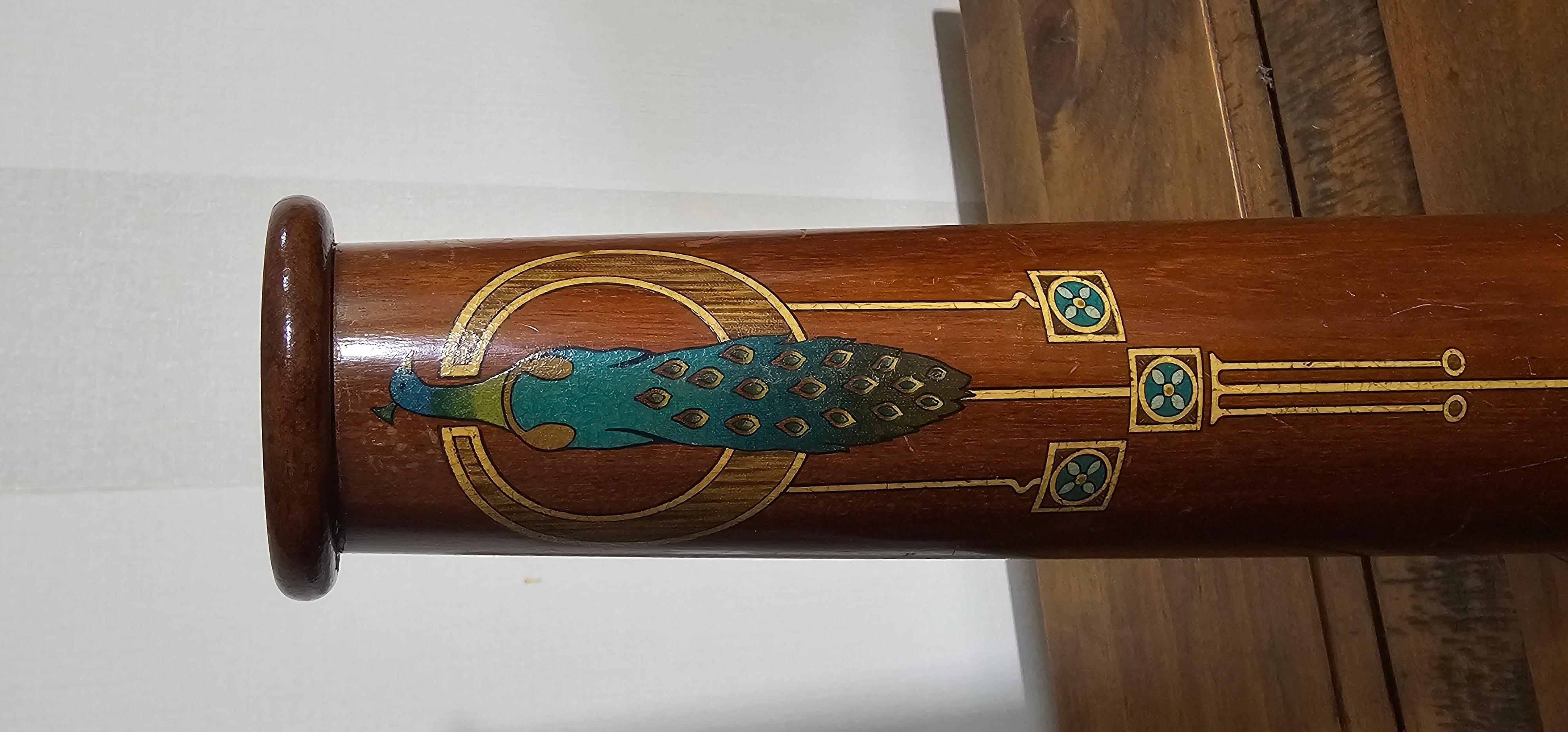This is a very unusual piece from the Early 20th Century Art Nouveau period. A Kalaidescope in full working order . Hand crafted from Teak wood and varnished. Hand painted design of a glorious peacock montage. This would make a nice decorative