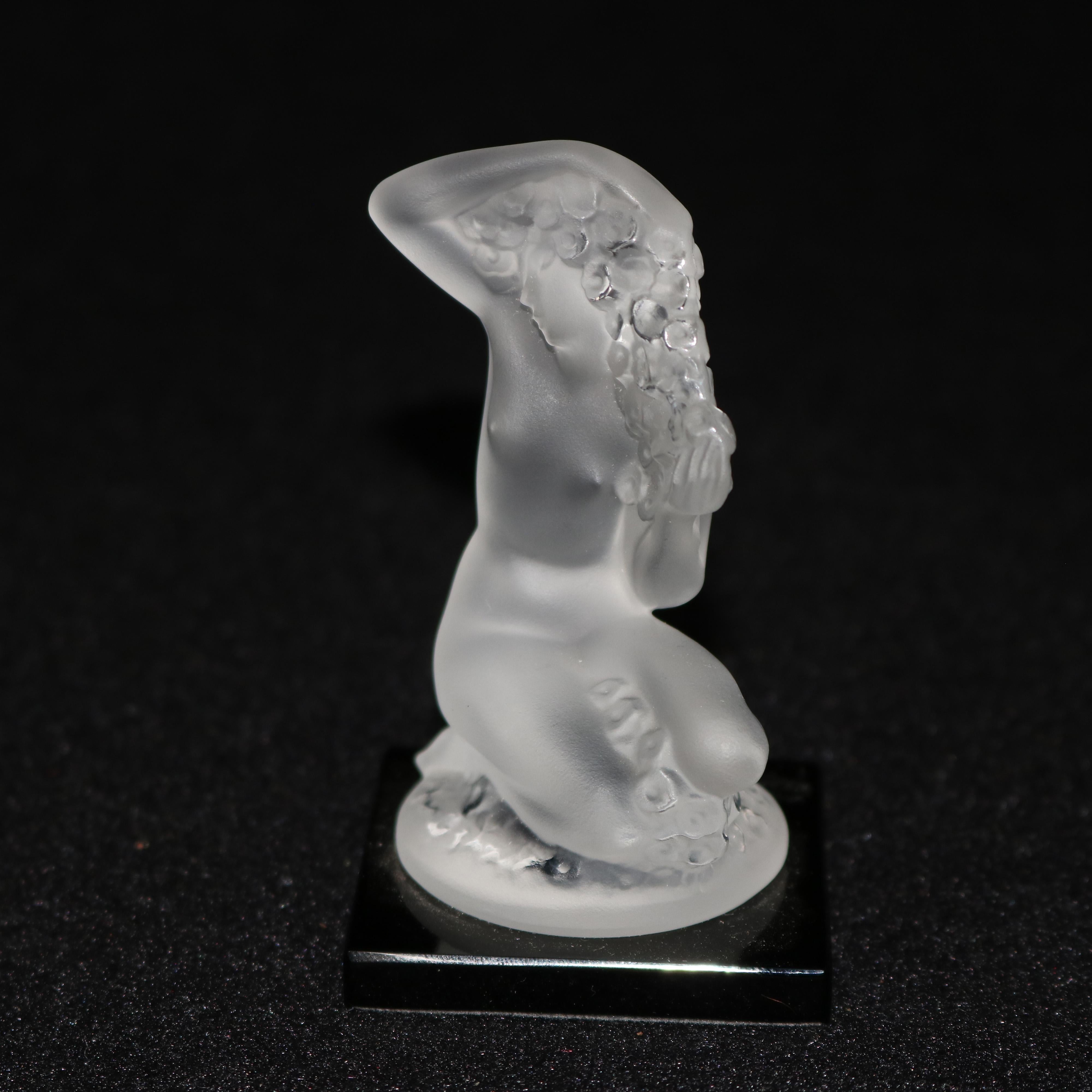 A French Art Nouveau style desk paperweight figure by Lalique offers frosted crystal portrait sculpture of nude woman titled 