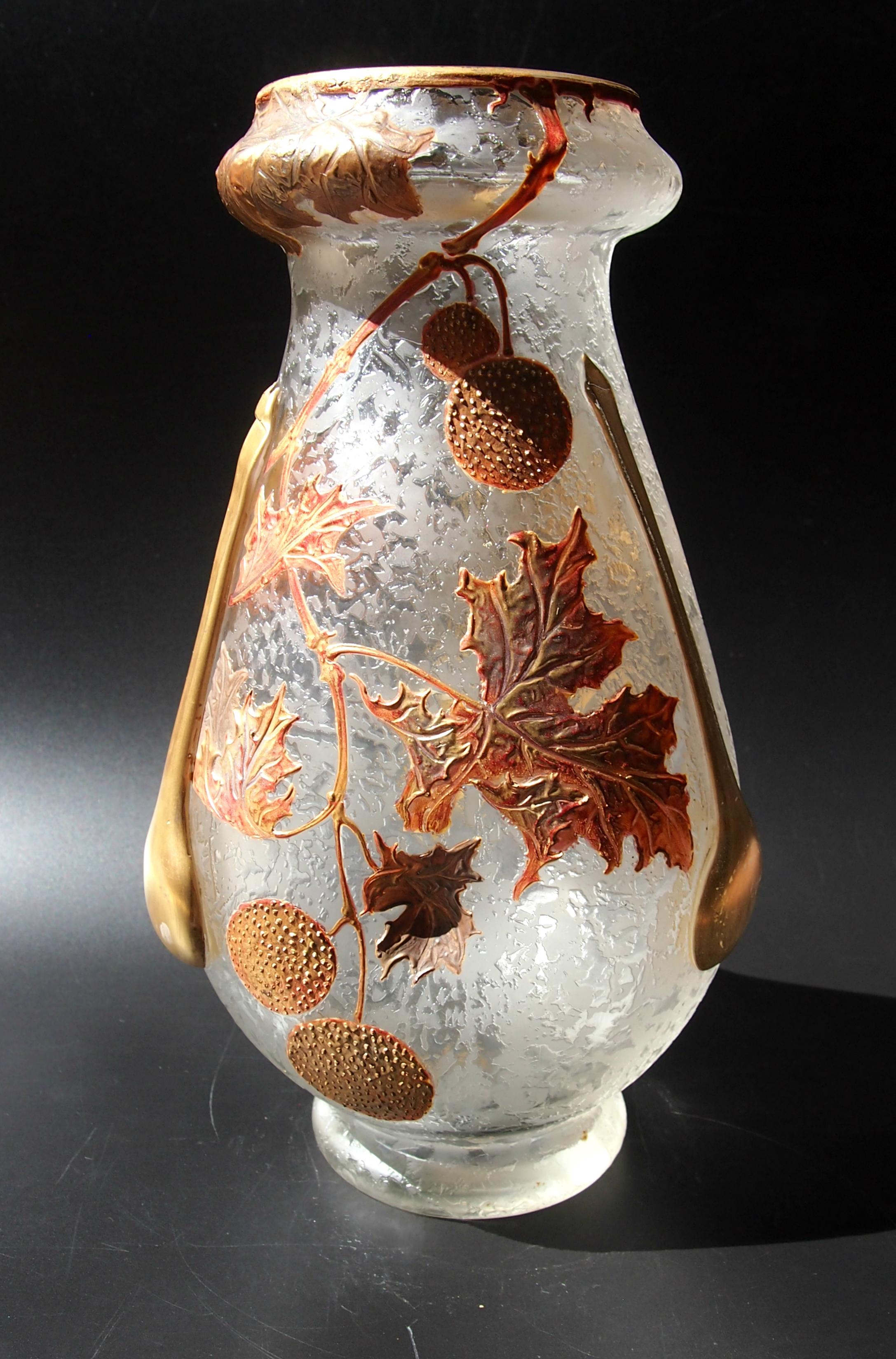 Stunning deeply acid cut back and polychrome gilded early Art Nouveau Legras 'tear' vase from the end of the 19th century. Decorated in a variety of muted metallic enamels with an autumnal scene of dried leaves and 'pom-pom' seed pods with three hot
