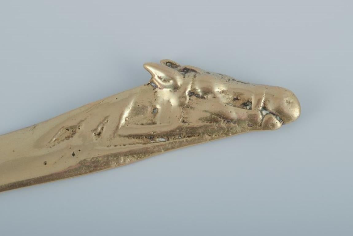 Scandinavian Art Nouveau letter opener in the shape of a horse's head. Brass.