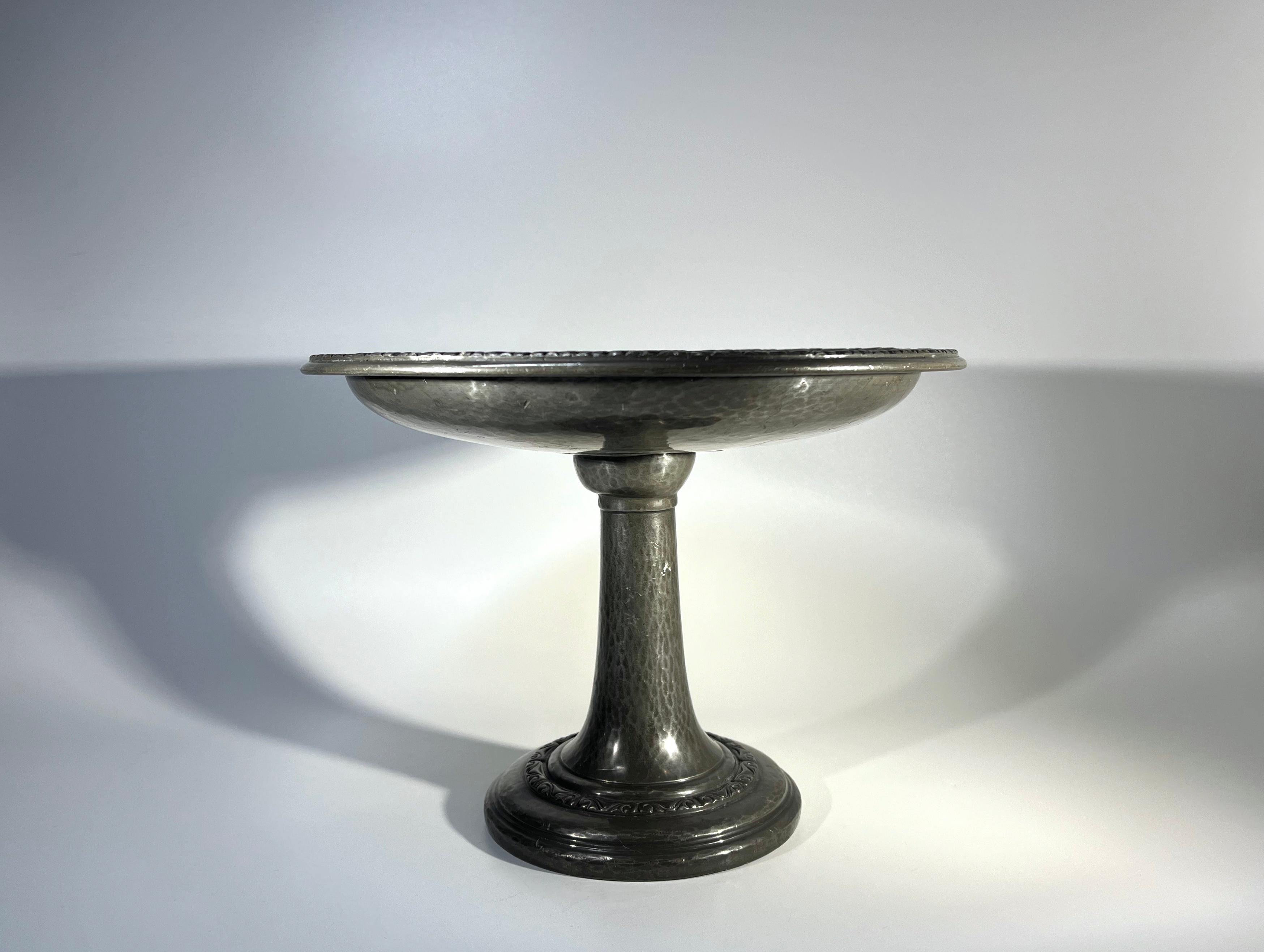 Splendid Art Nouveau antique pewter tazza for Liberty & Co., Regent Street, London
Tall, impressive table centrepiece with hand hammered and stylised decoration
Circa 1910
Signed 'Tudric', English Pewter, Liberty & Co 01388 to base
Height 7 inch,