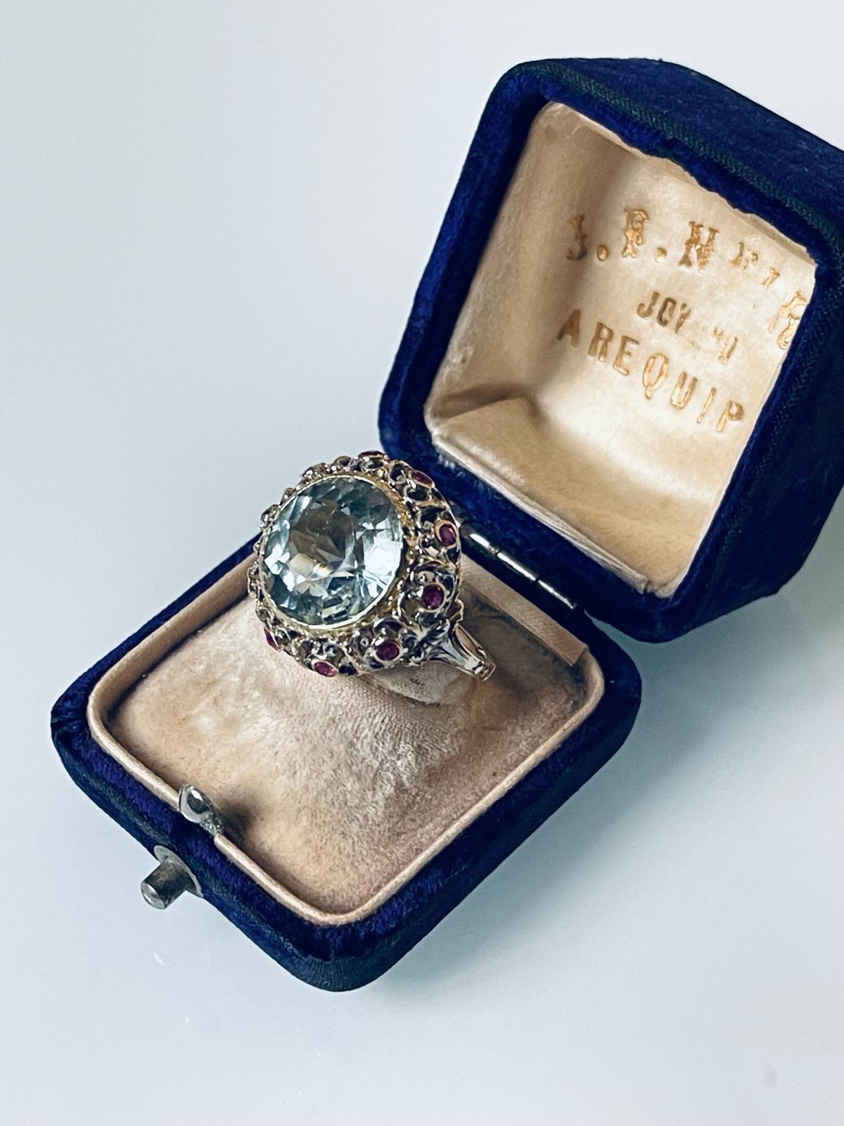 An early 20th C Italian ring, finely hand made in Florentine goldsmith tradition (starting in 16th C) distinguished for its refined fretwork (perforation) and engraving. 

This nice example of Florentine jewellery art is set with a large round cut