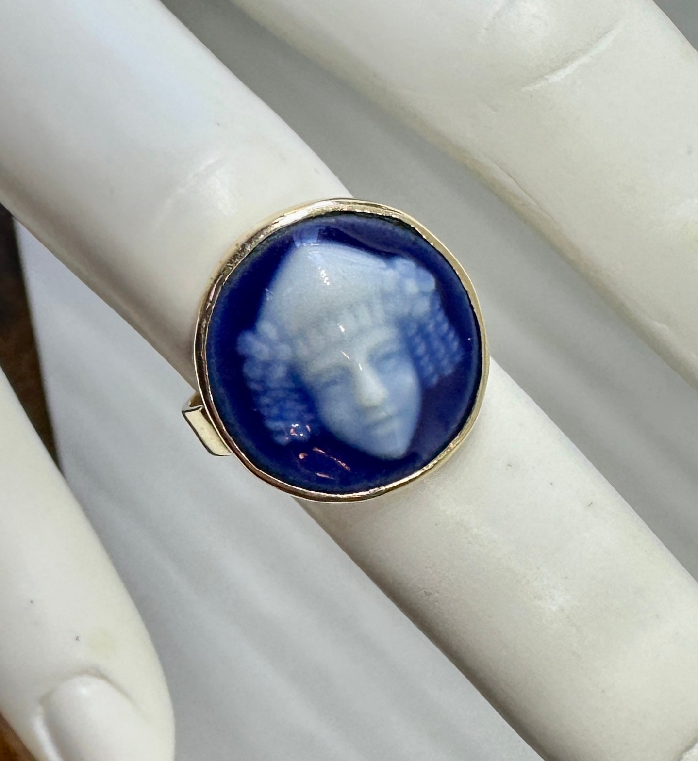 This is a rare French Art Deco - Art Nouveau Limoges Enamel Ring with an image of the God Bacchus in exquisite blue and white Pate de Verre enamel  in 10 Karat Gold.  The magnificent portrait of Bacchus is created with vivid iridescent blue and