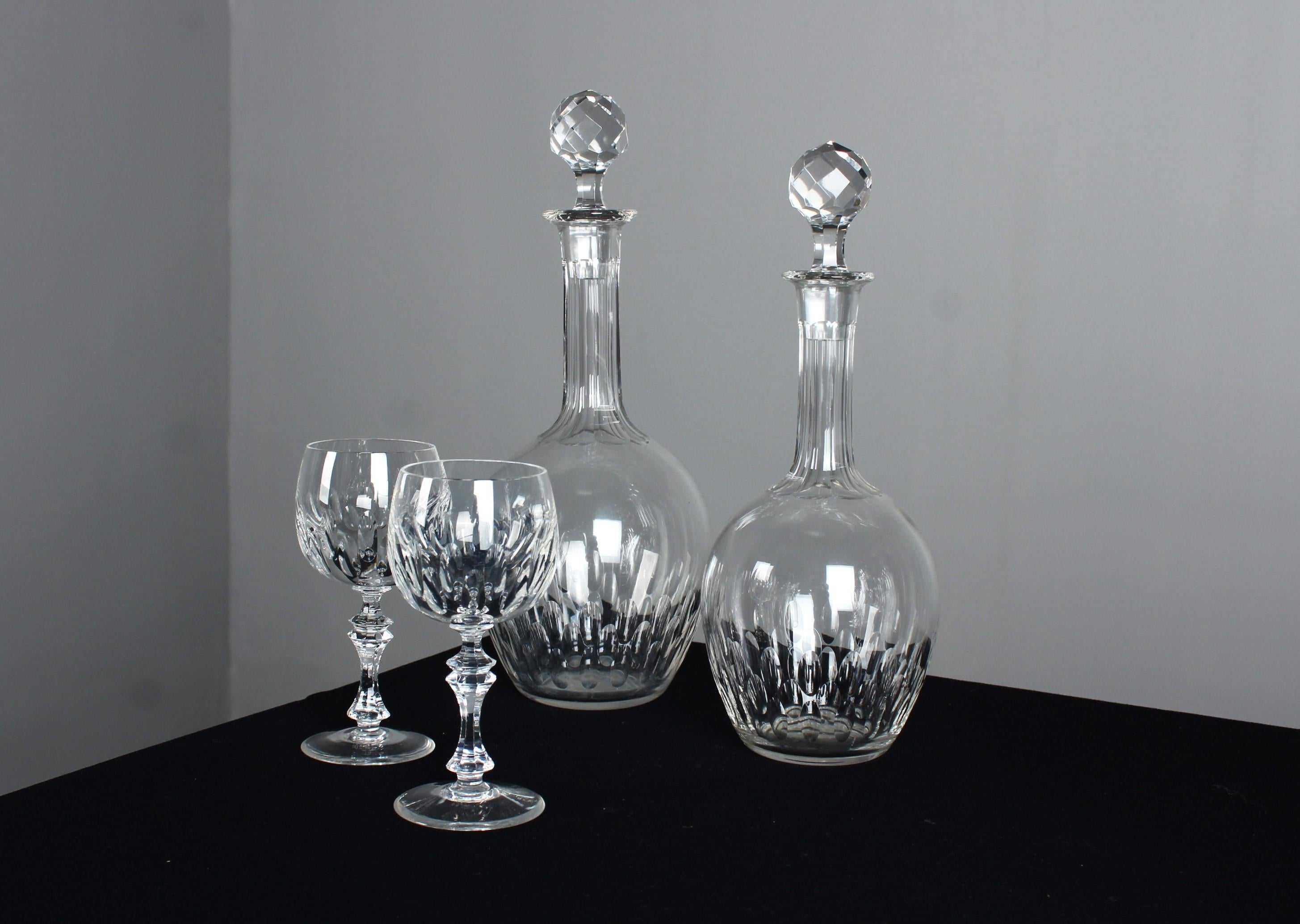 A beautiful set of two antique carafes with two matching liqueur or wine glasses.

In France at the beginning of the 20th century, particularly around 1900, carafes experienced a highlight of elegance and sophistication. This period, often known as