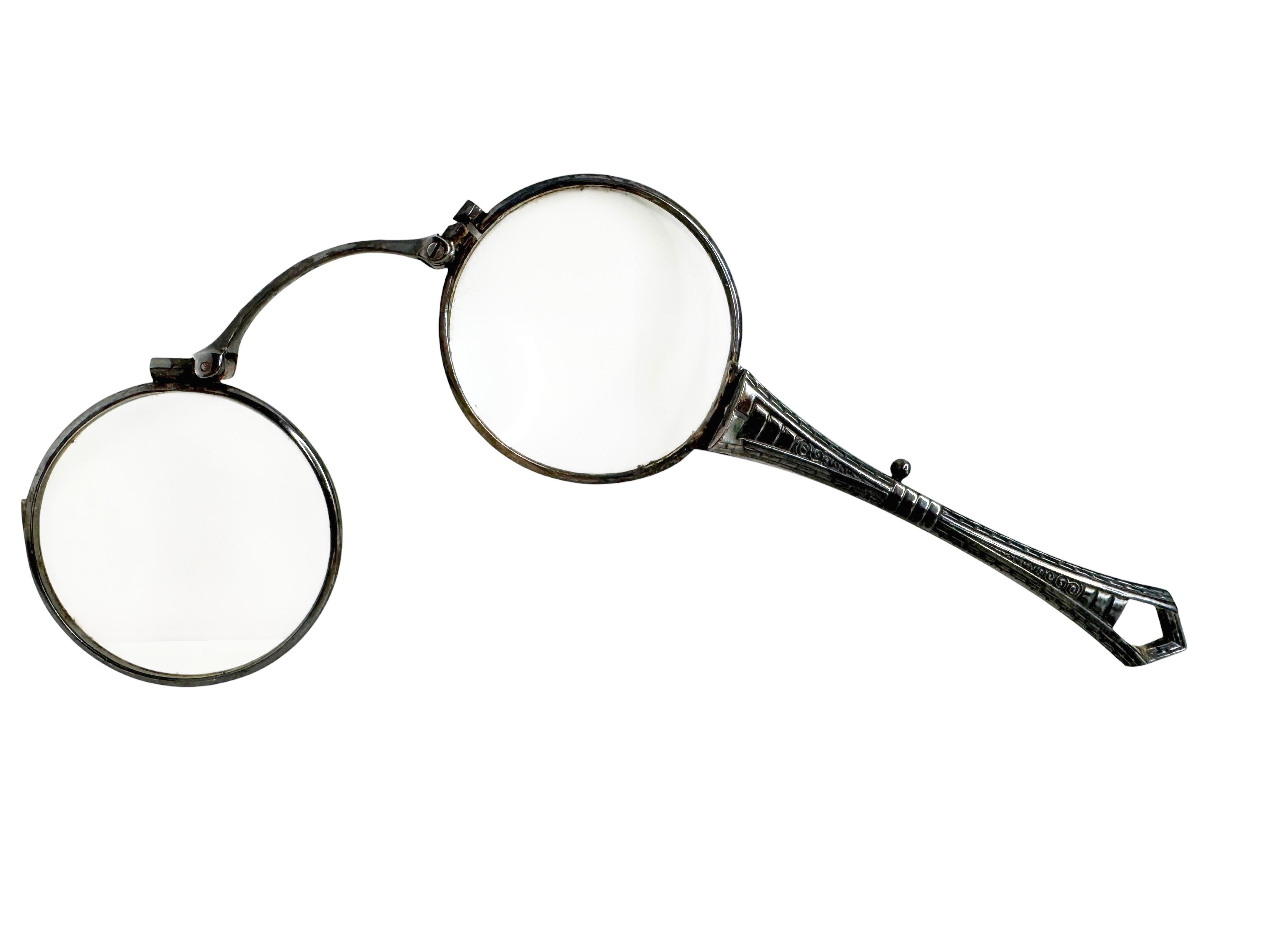 A gorgeous old fashioned antique lorgnette with a refined design on the handle. This pair of eyeglasses or opera glasses feature a 