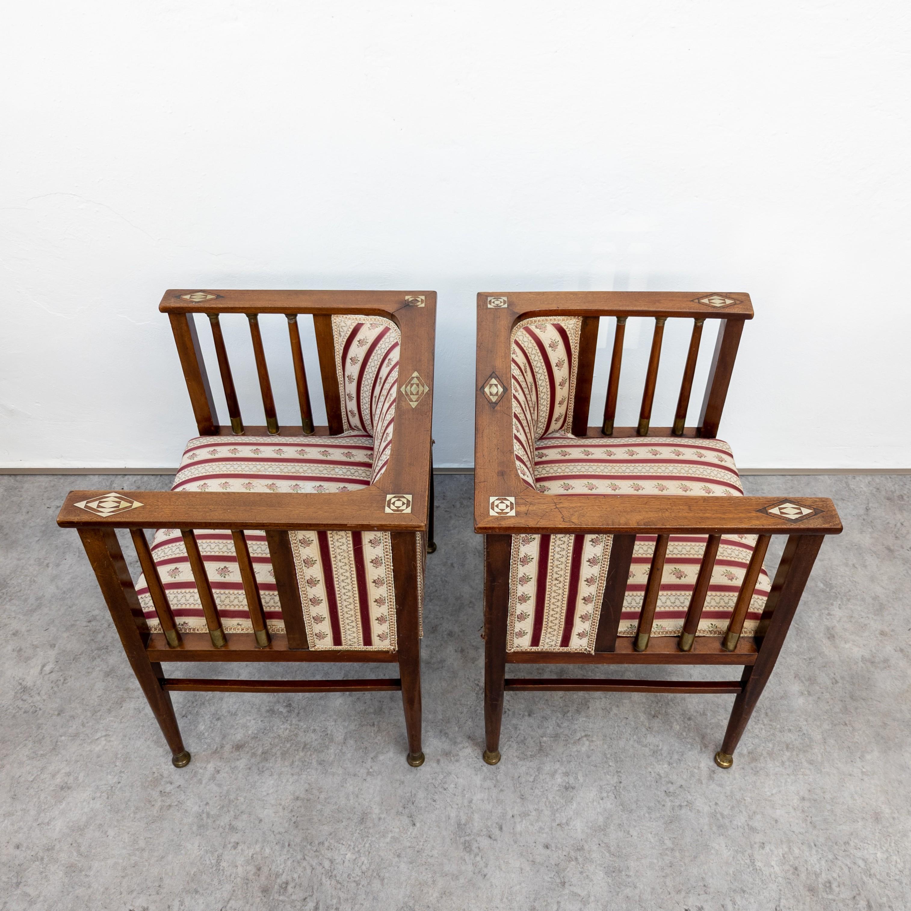 Very rare drawing room armchairs designed by German artist Hans Christiansen (1866-1945) around 1910s. Manufactured probably by Ludwig Schäfer, Mainz. Made of solid mahogany and mahogany veneer with metal inlays, brass fittings. In very good
